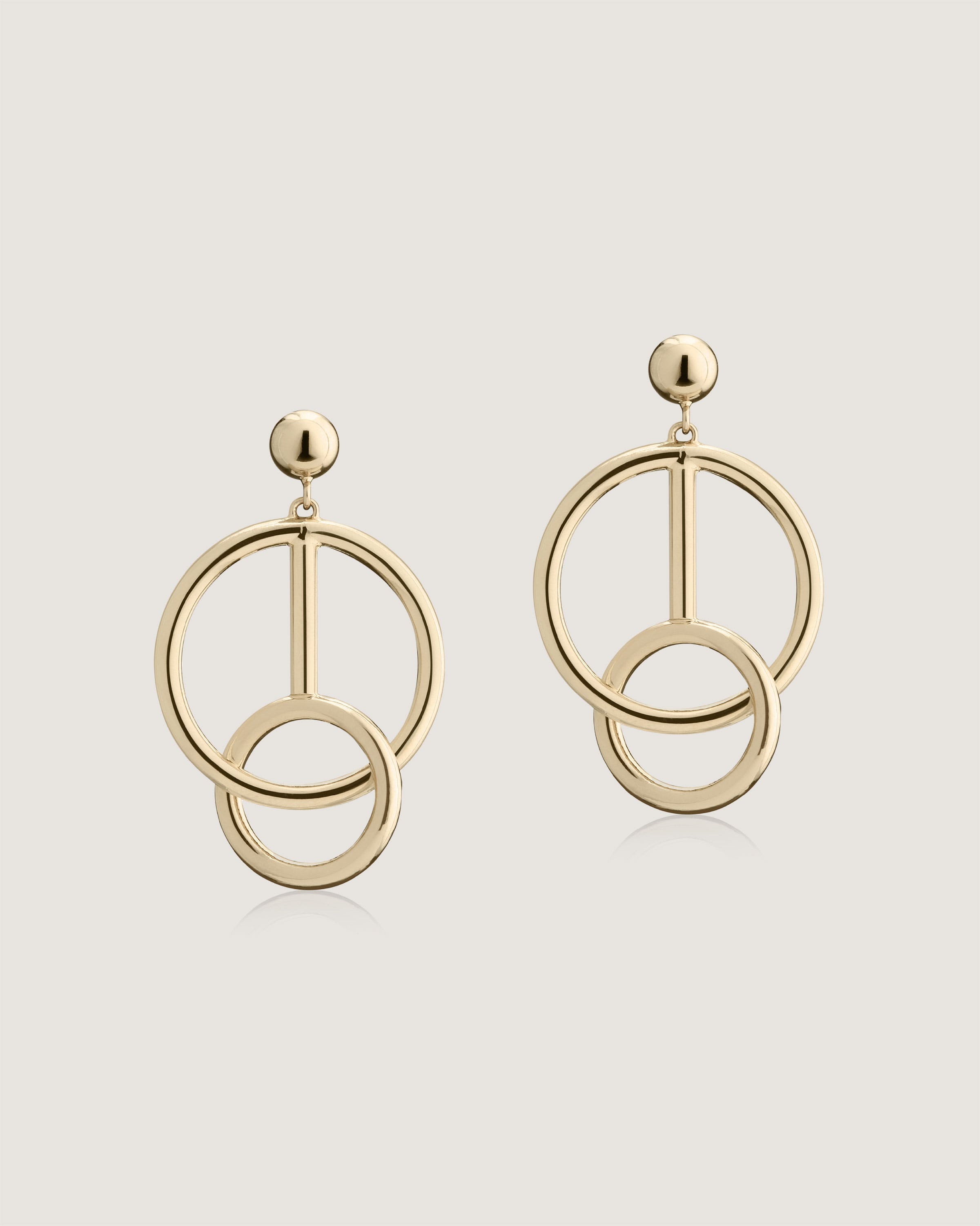 A pair of earrings with a circular design