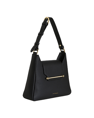 A black handbag with a gold handle