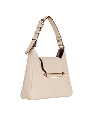 A white handbag with a metal handle