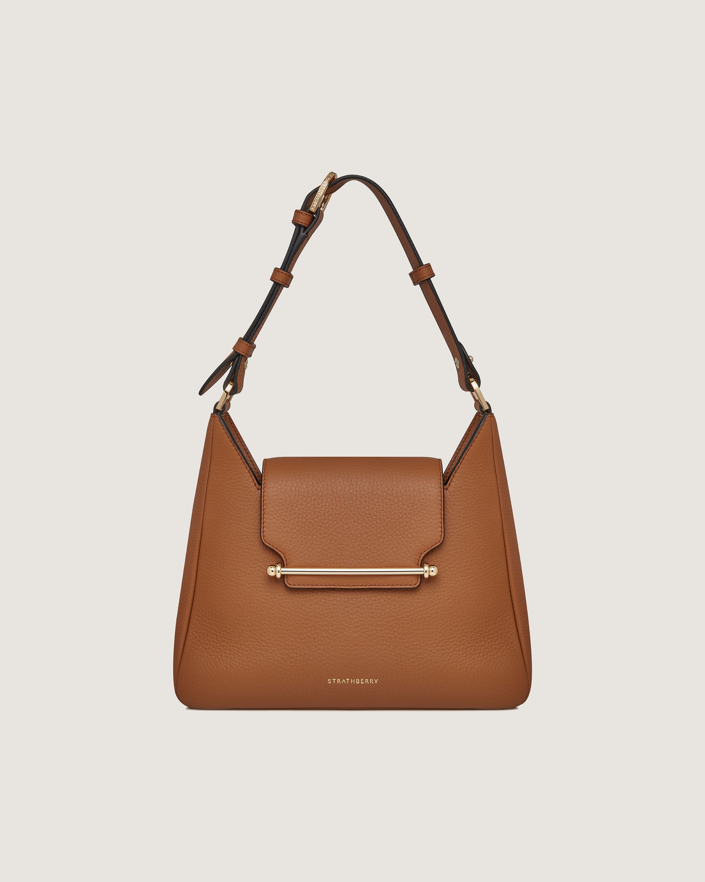 A brown handbag with a long handle