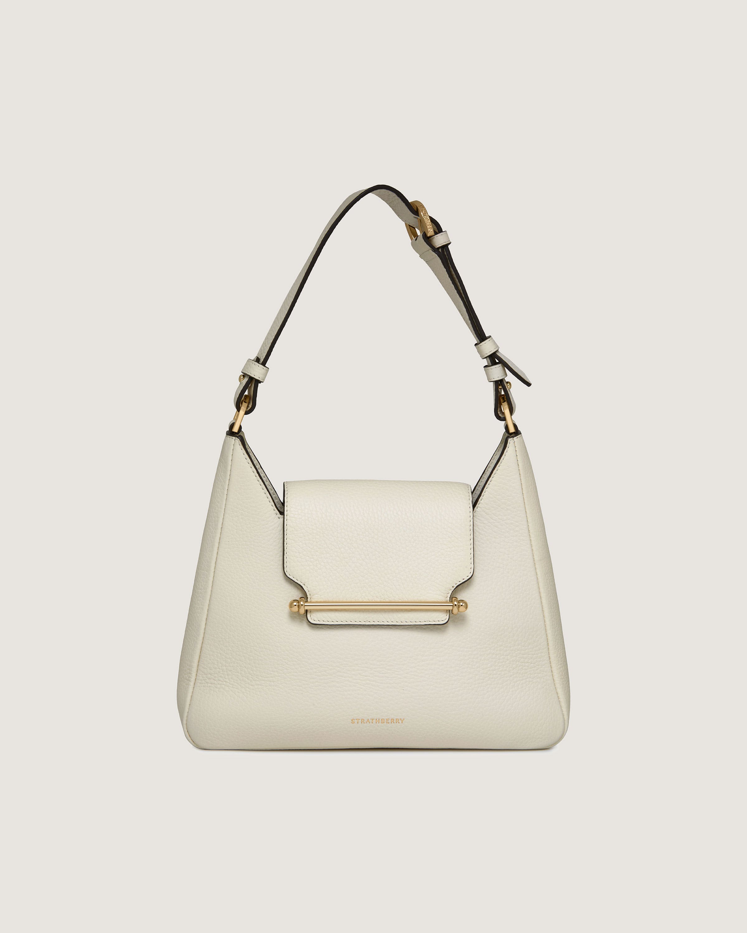 A white handbag with a metal handle