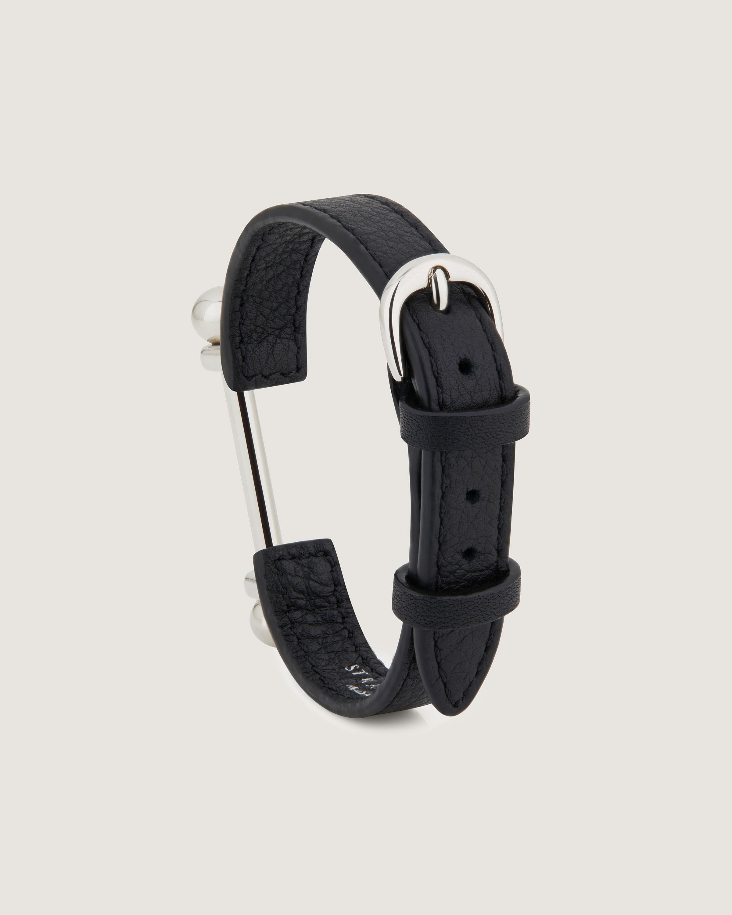 A black leather bracelet with a silver buckle