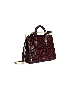 A handbag with a chain hanging from it