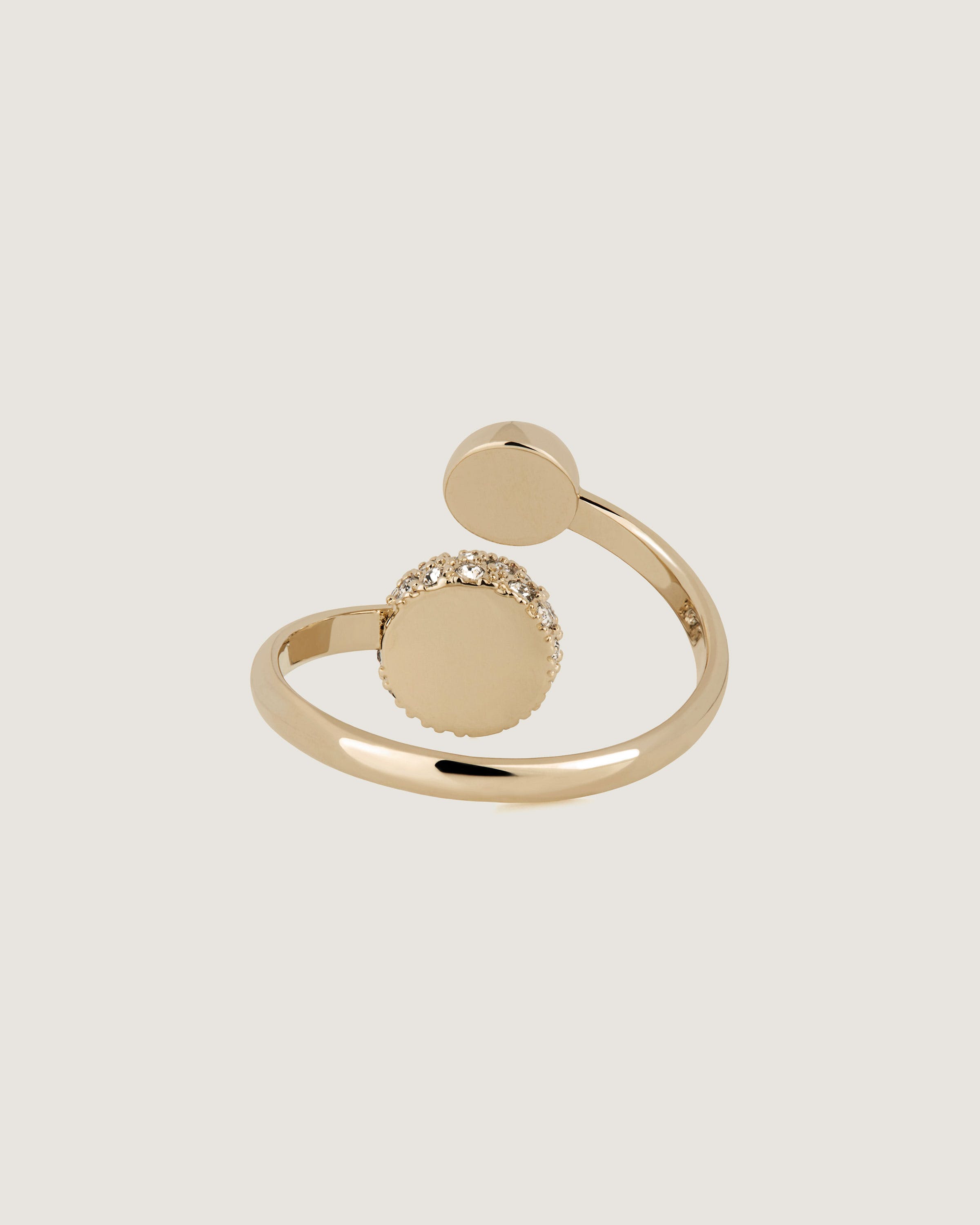 A gold ring with a round stone on it