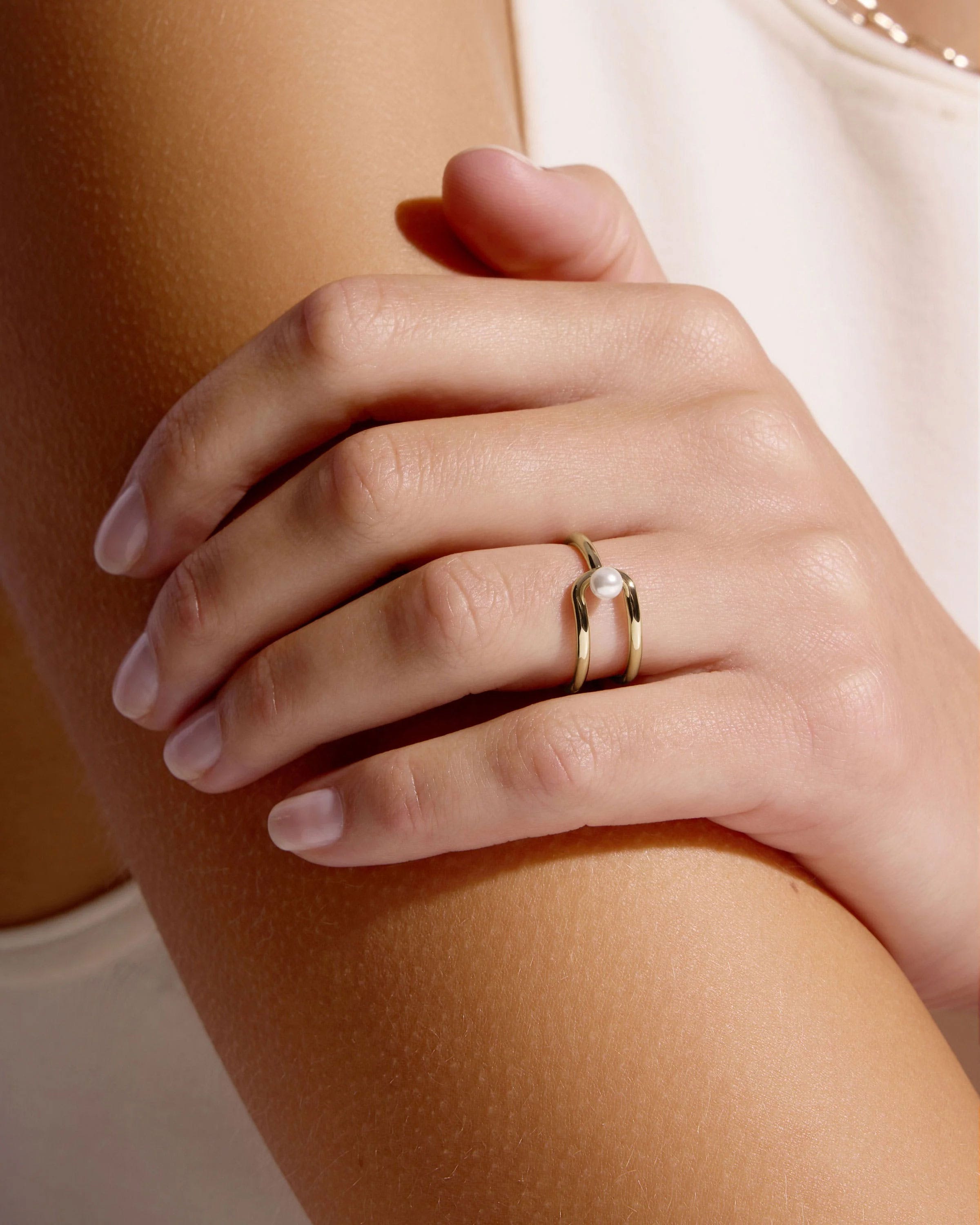 A woman's hand with a ring on it