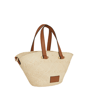 A straw bag with a brown leather handle