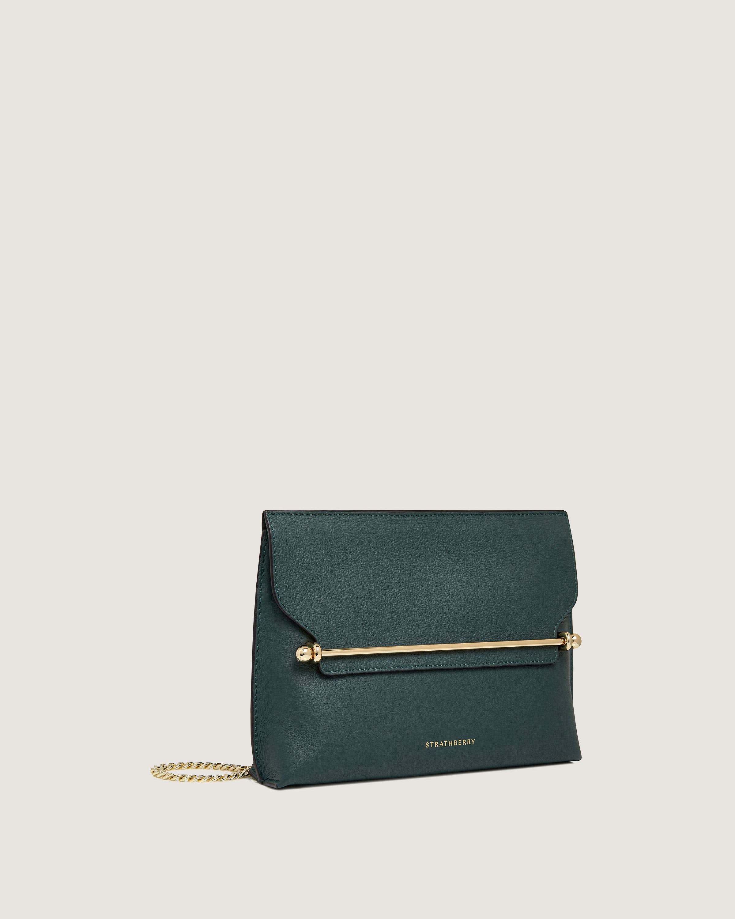 A green leather clutch bag with a gold chain