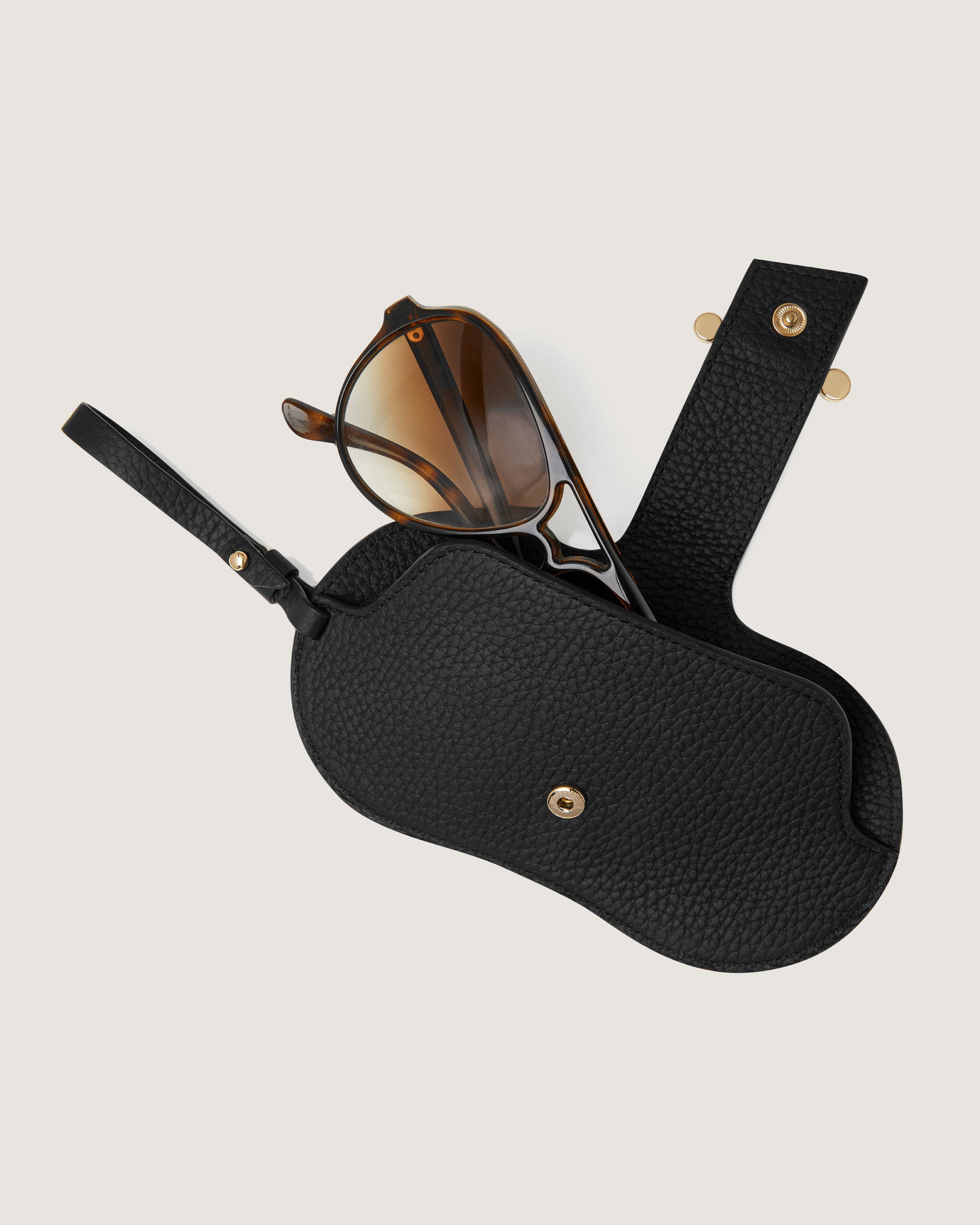 A pair of sunglasses sitting on top of a case