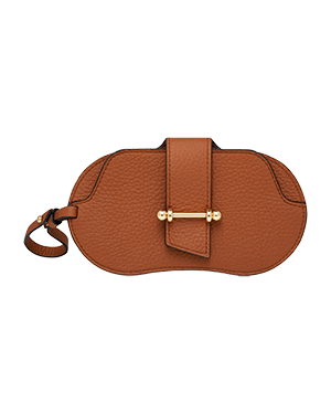 A brown leather purse with a gold handle