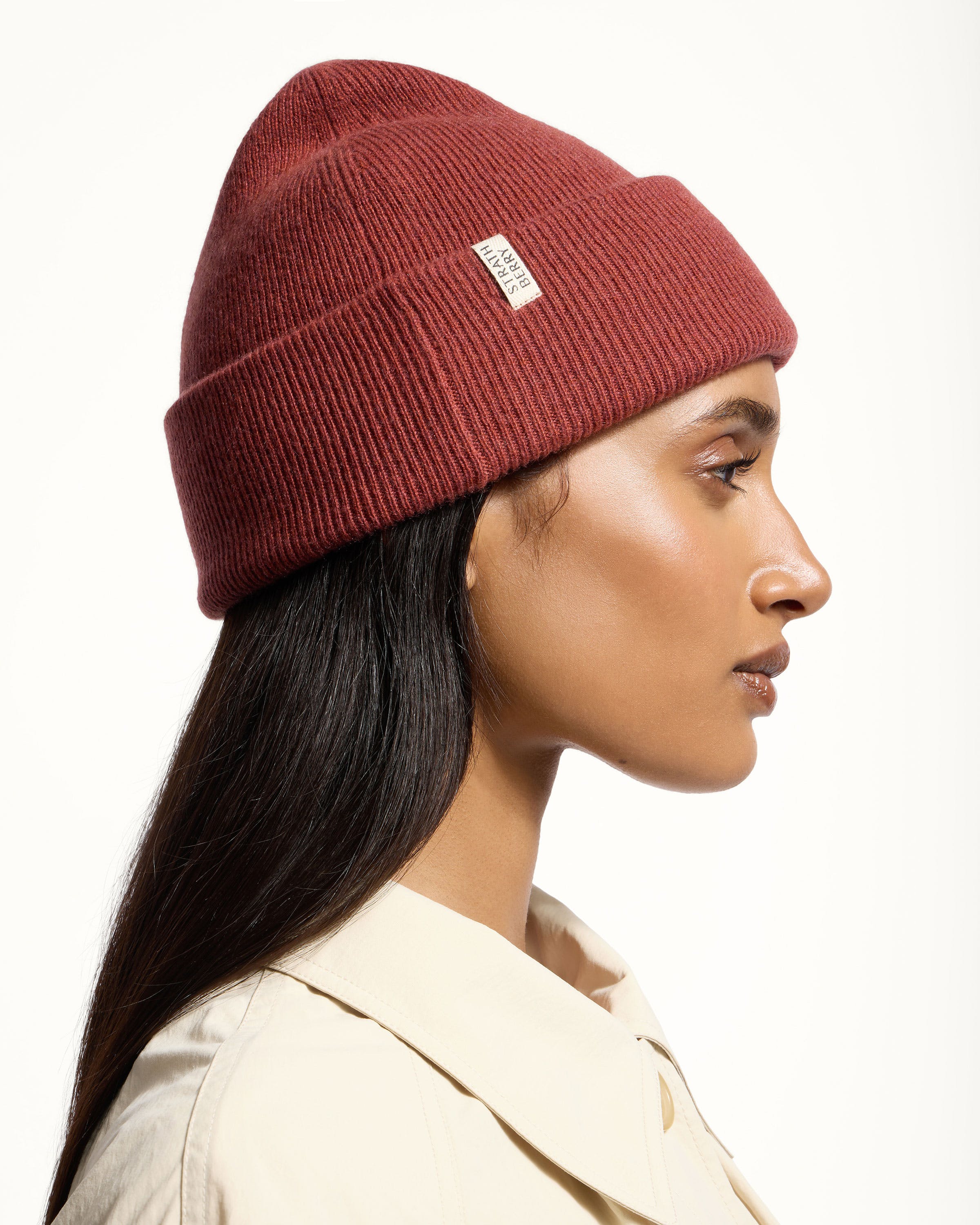 A woman wearing a red beanie hat