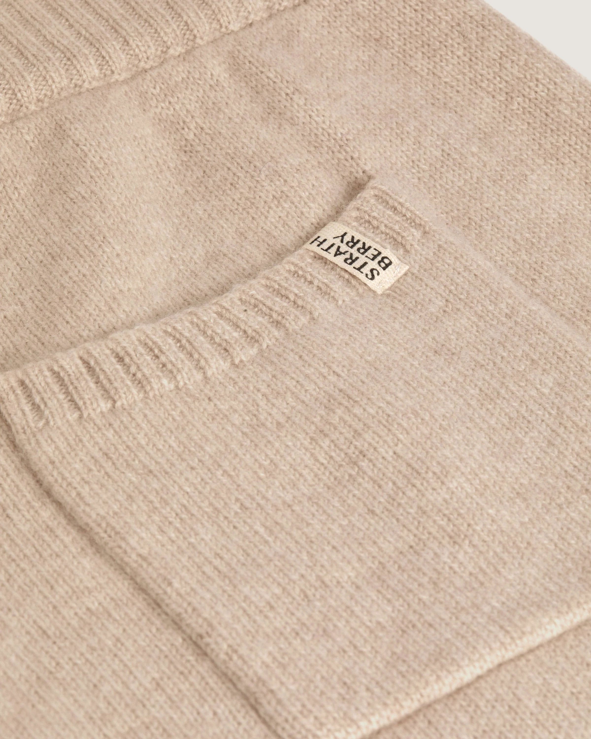 A close up of a sweater with a label on it