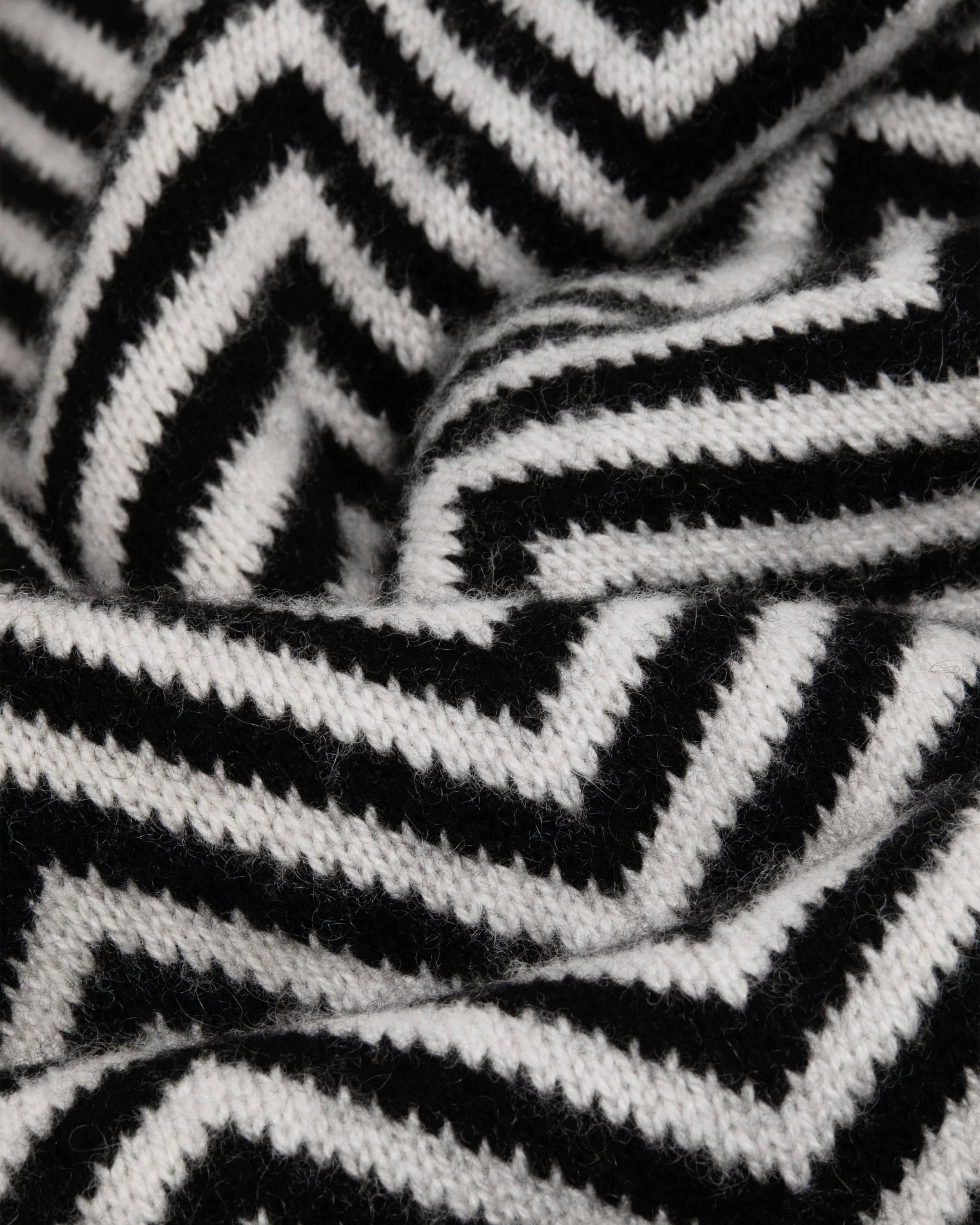 A close up of a black and white blanket