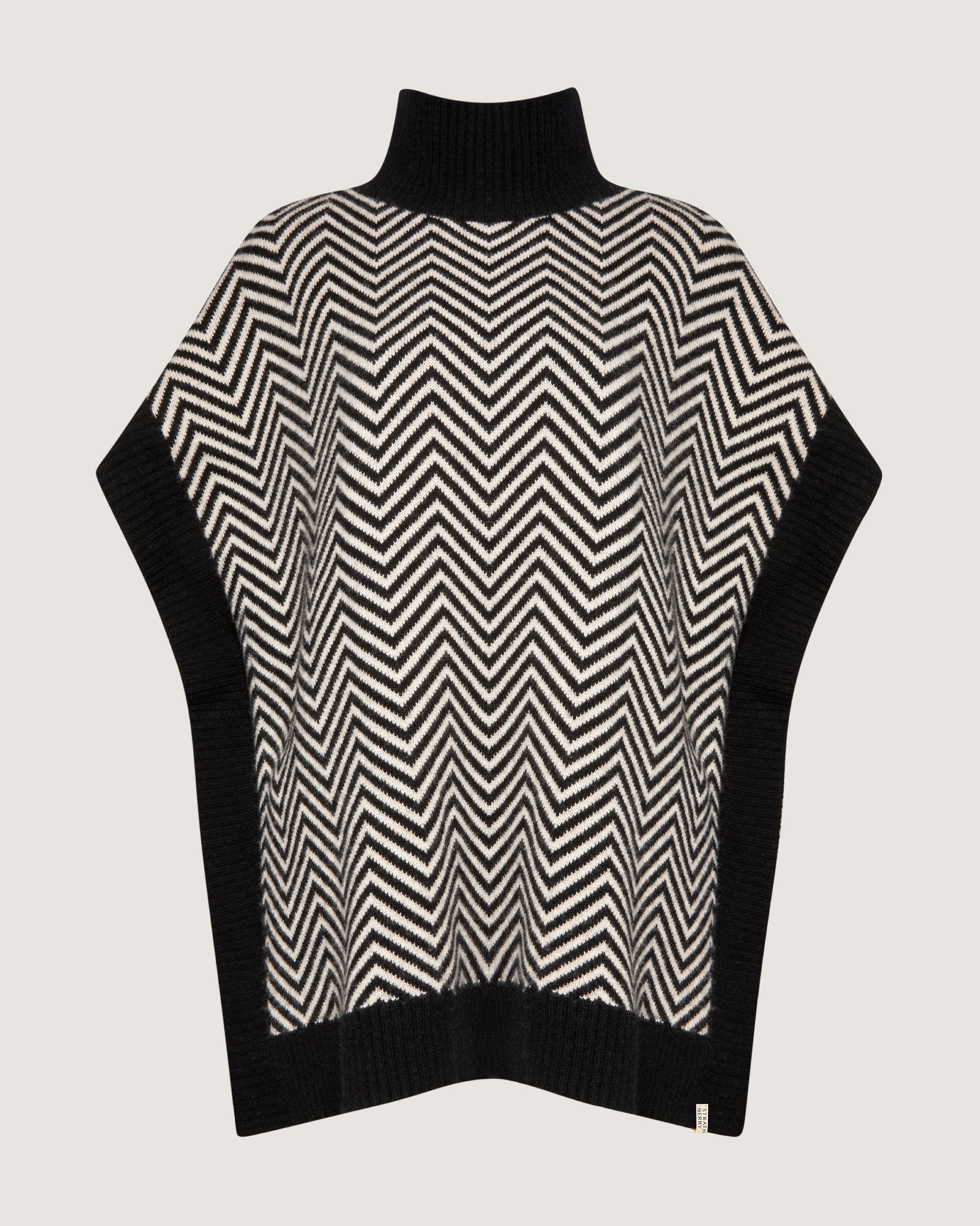 A black and white sweater with a black and white pattern