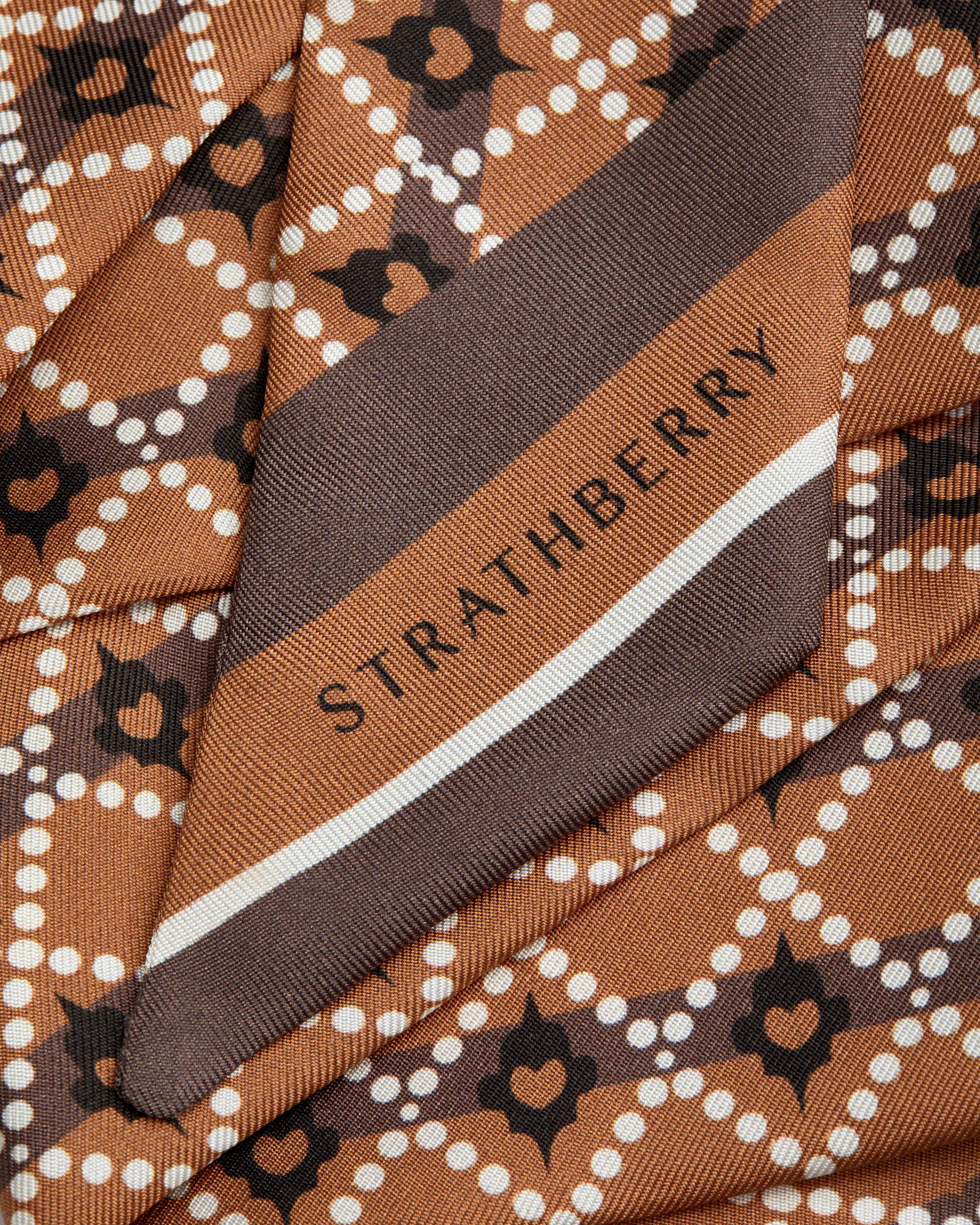 A close up of a tie with a name on it