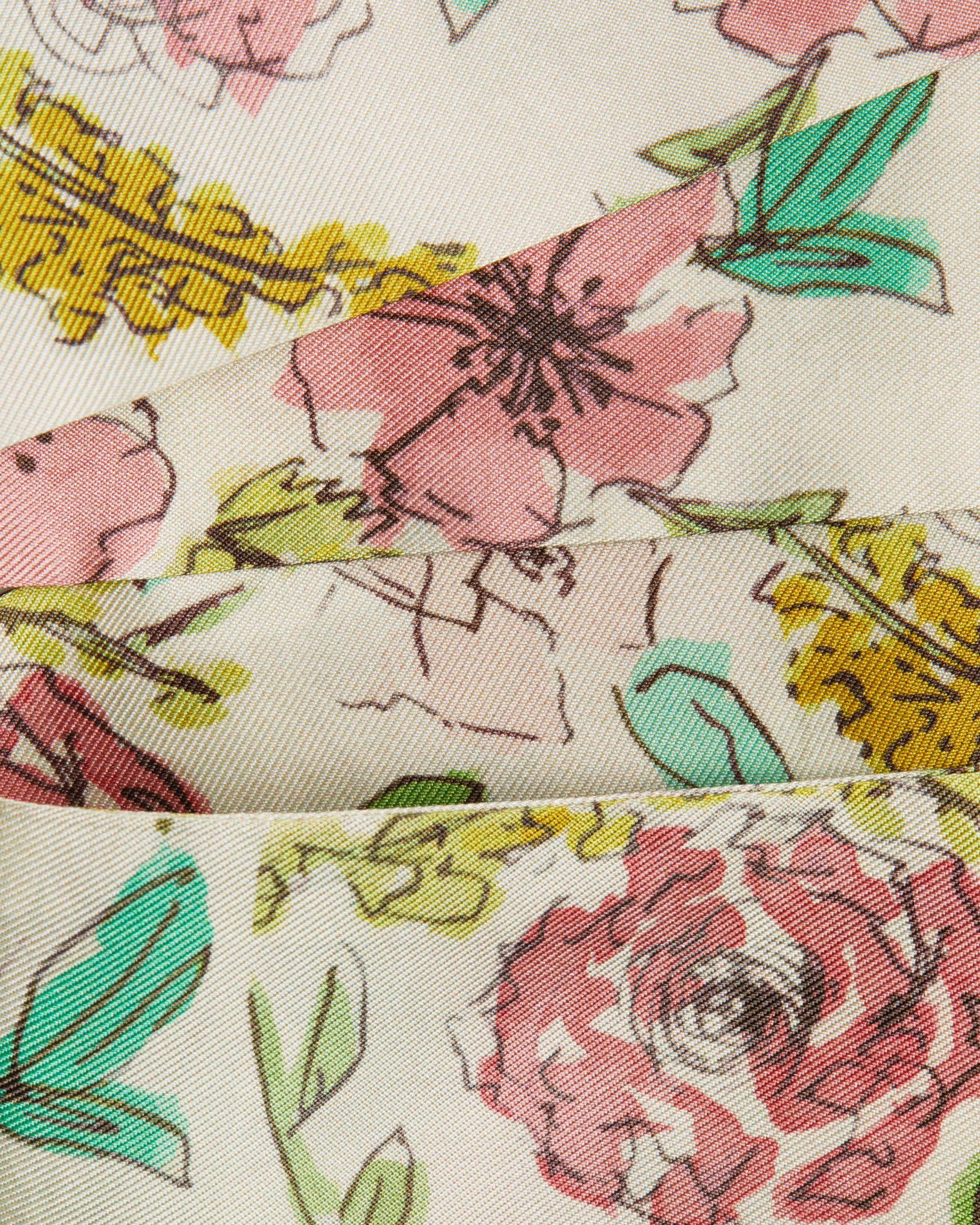 A close up of a tie with flowers on it