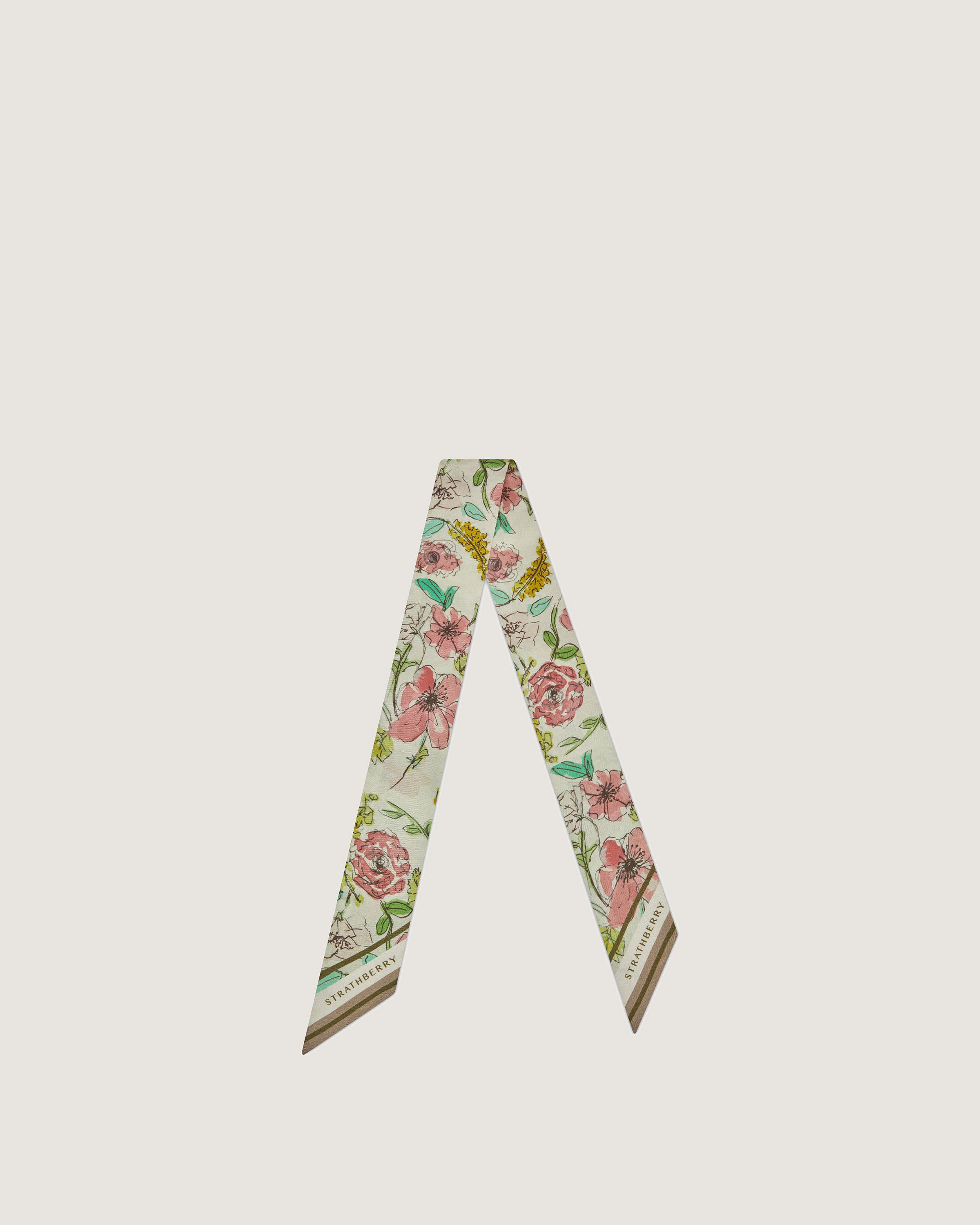 A white and pink flowered neck tie on a white background