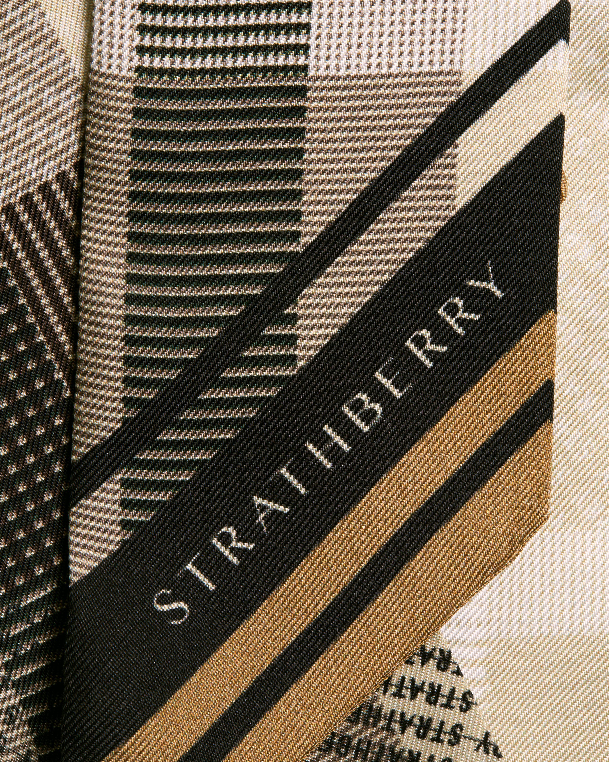 A close up of a tie with a name on it