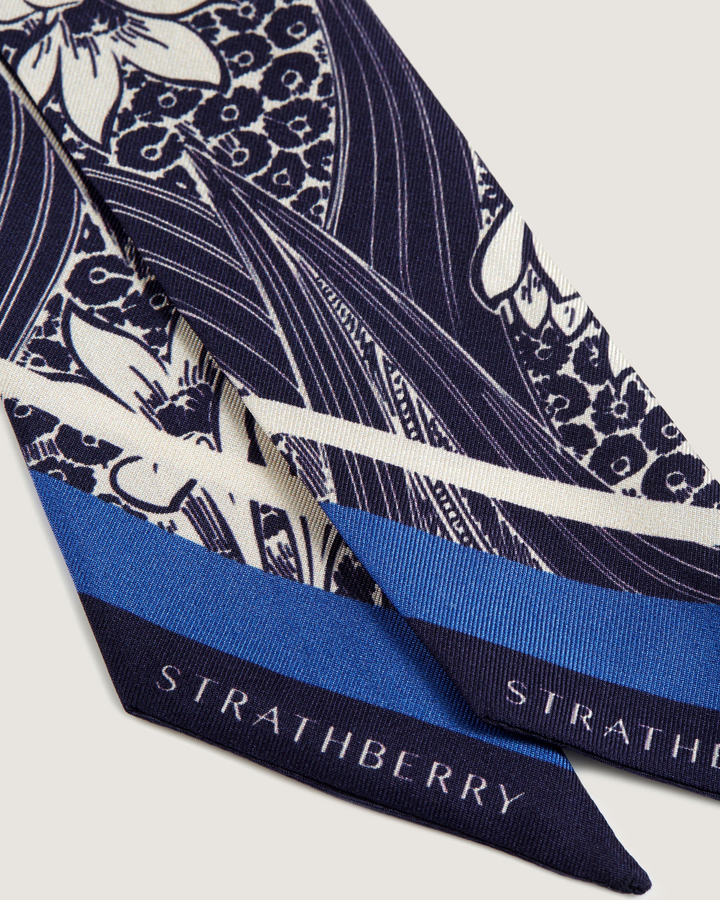 A close up of a blue and white tie