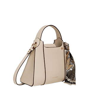 A white handbag with a floral print on it