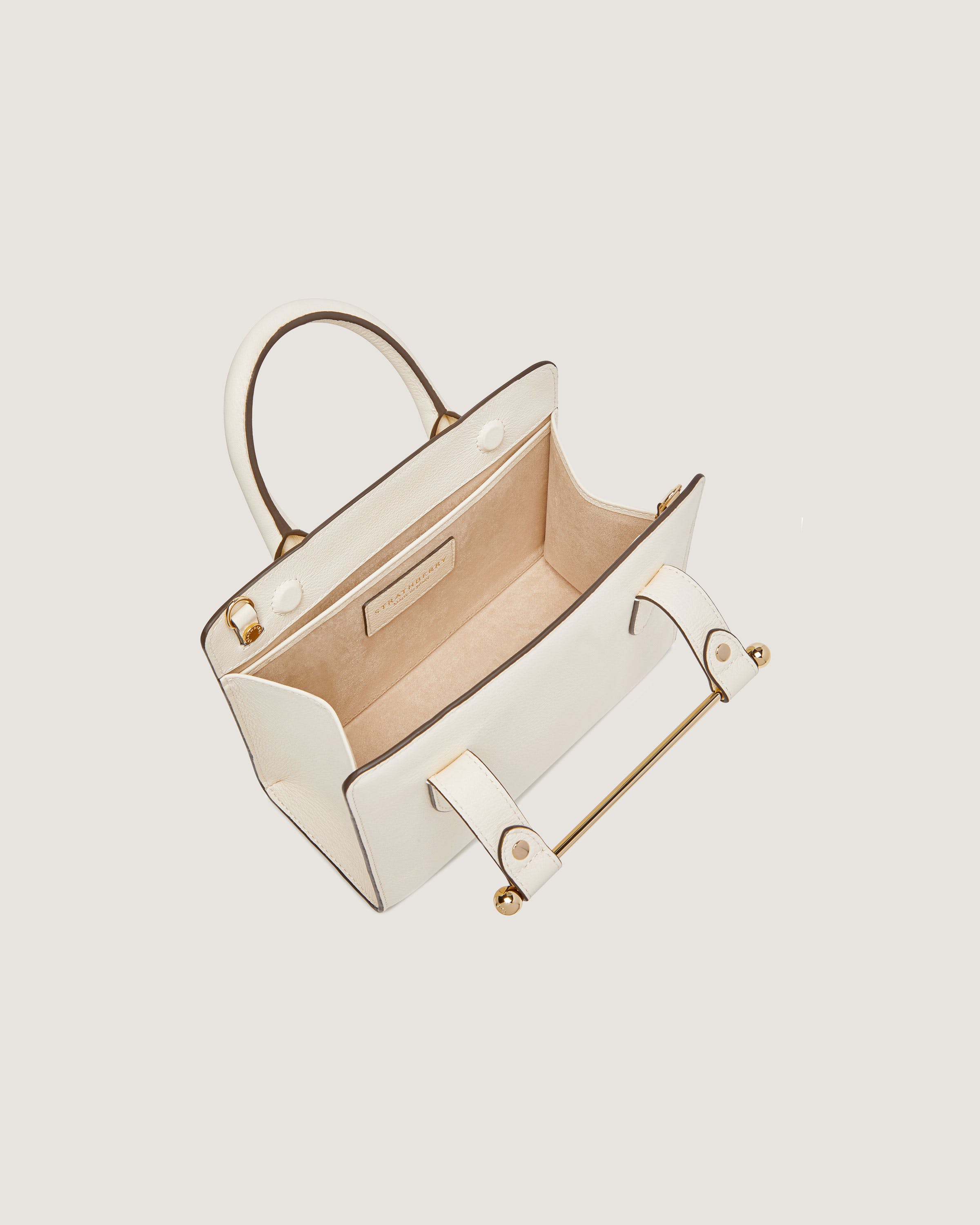 A white handbag with a handle on a white background