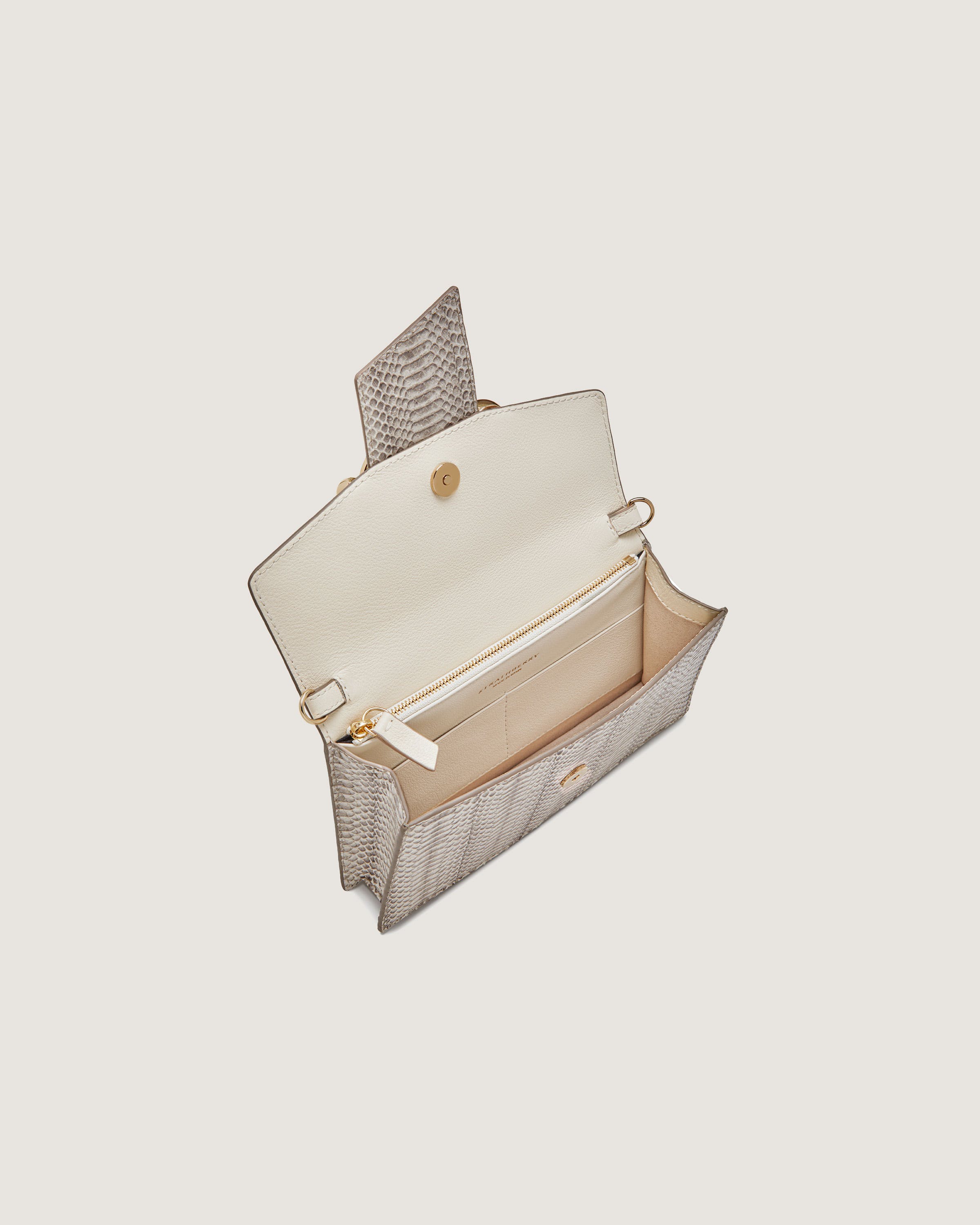 A white purse with a handle on a white background