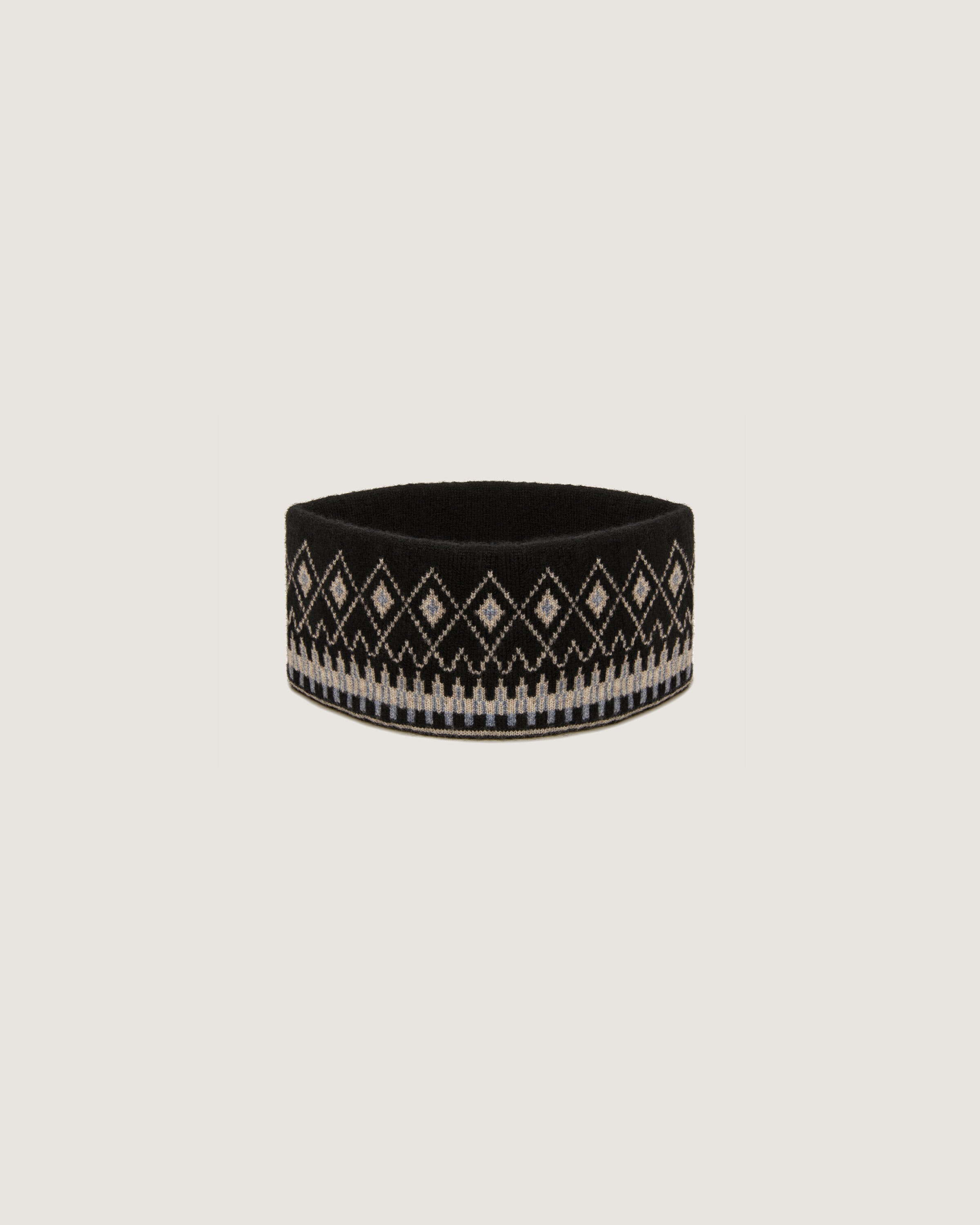 A black and white bracelet on a white background