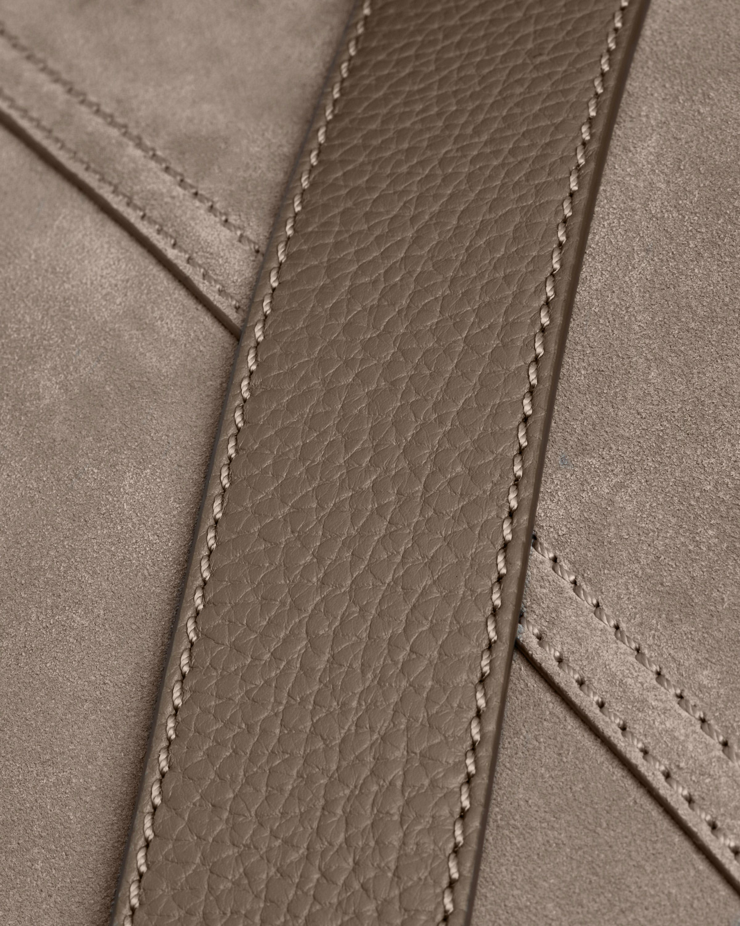 A close up of a brown leather purse