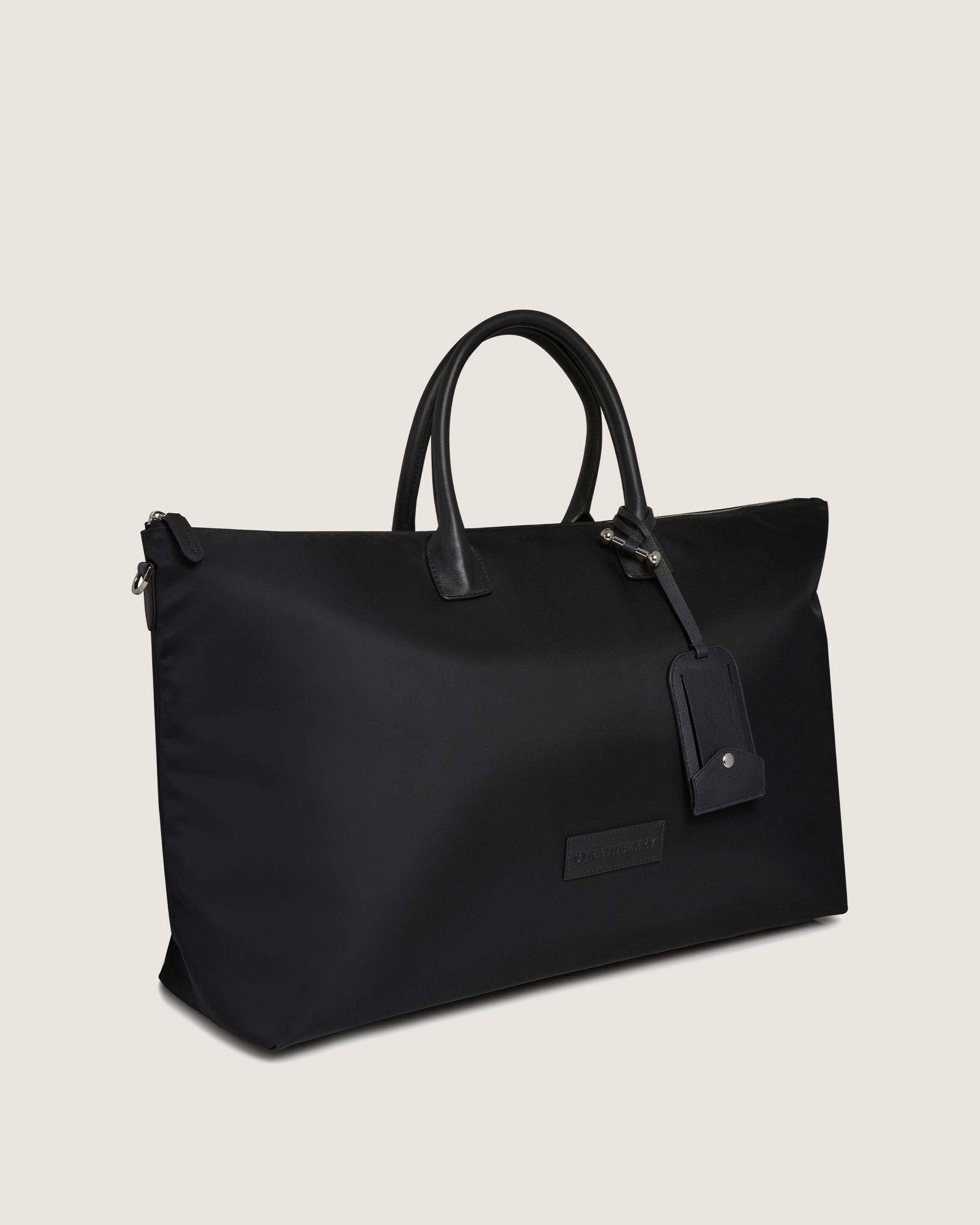 A black tote bag on a white background