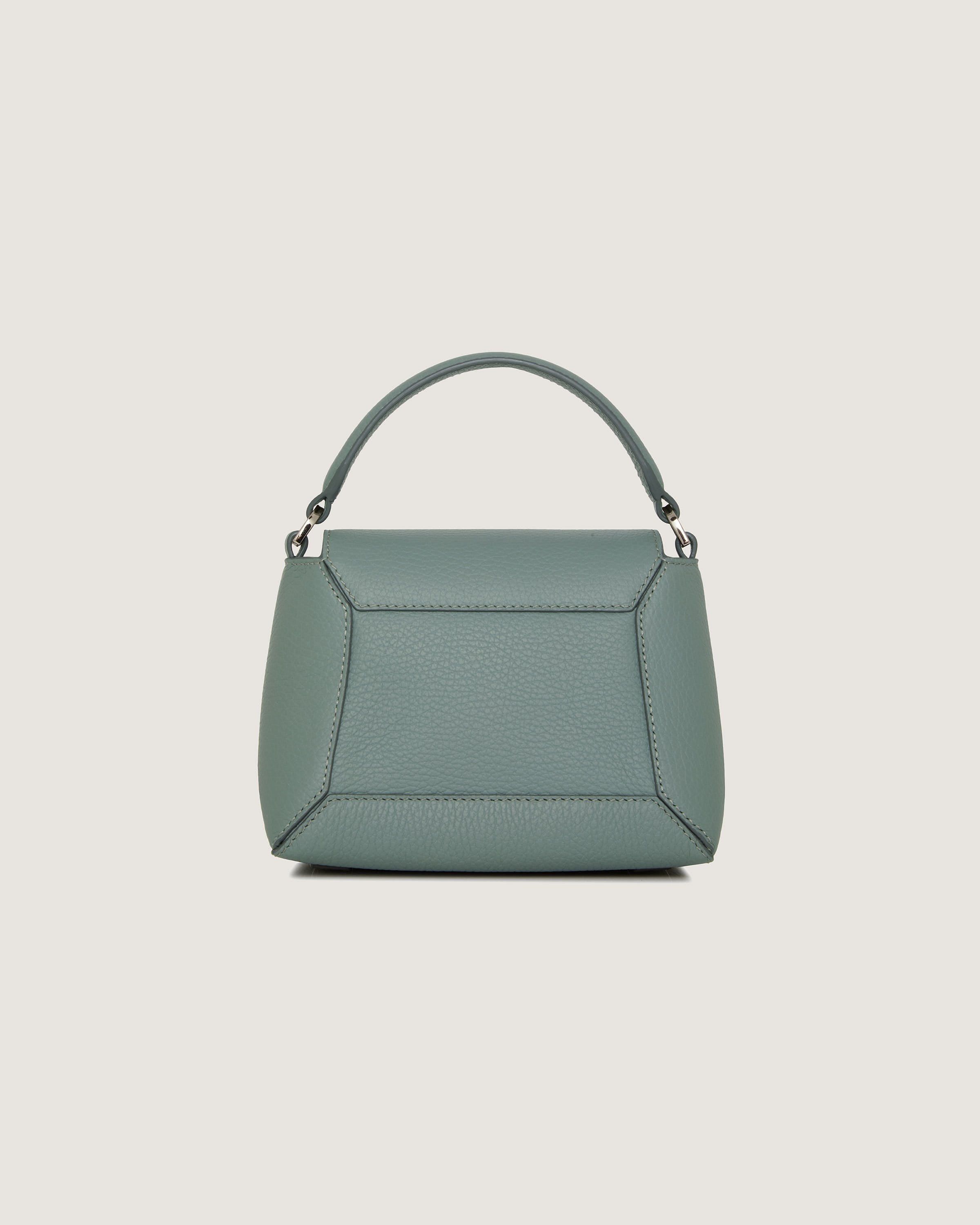 A green handbag on a white background