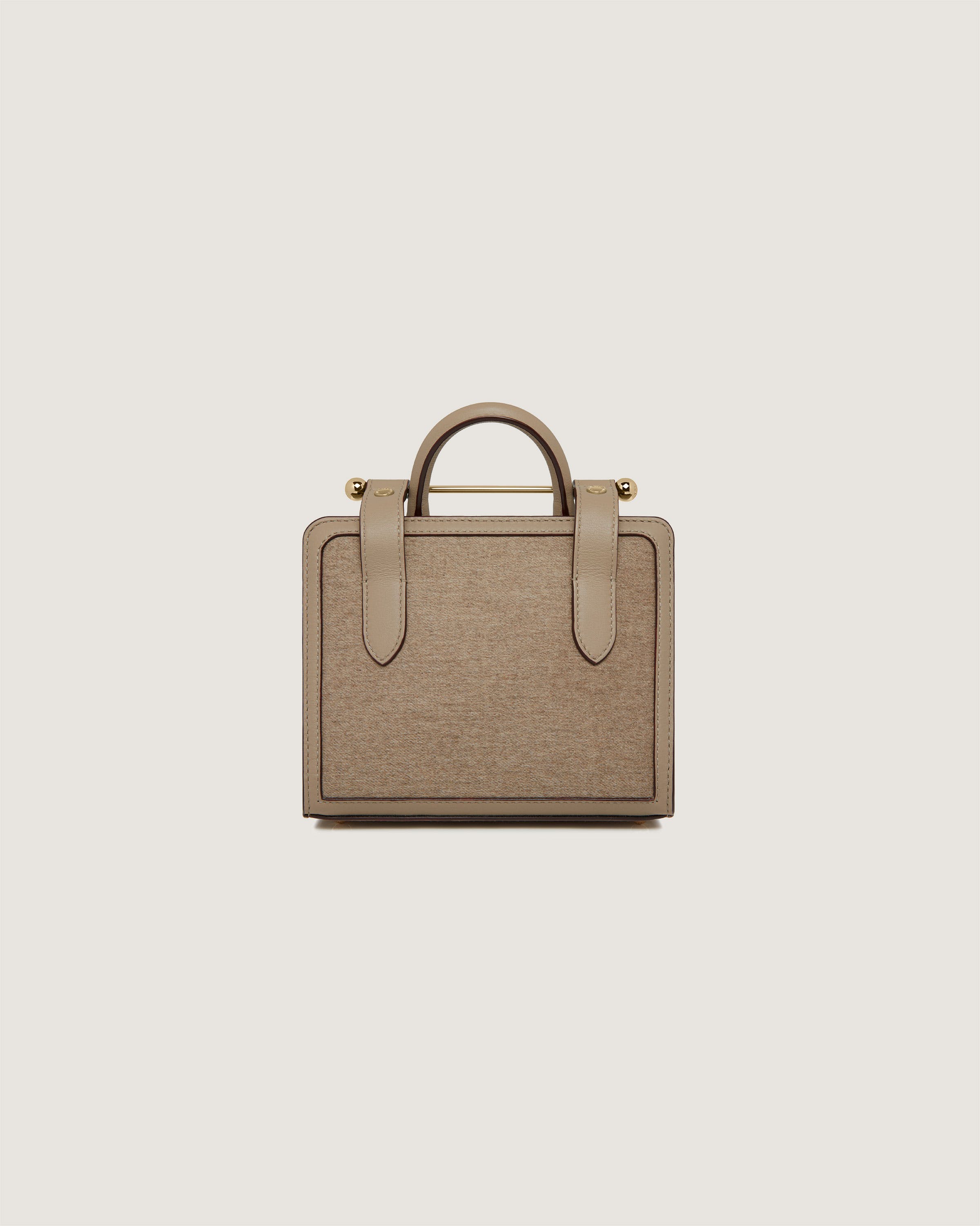 A tan briefcase with a handle on a white background