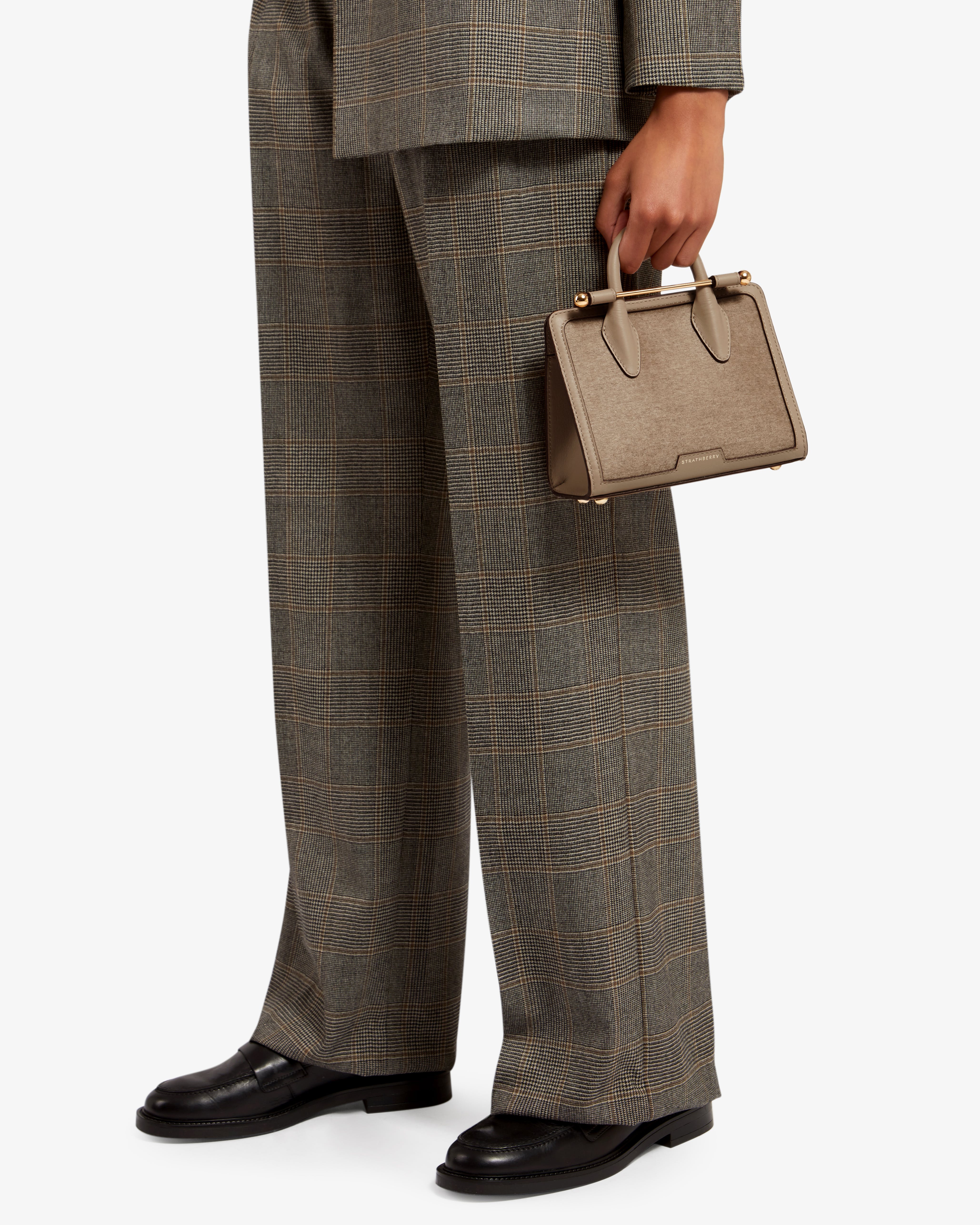 A man in a suit holding a briefcase