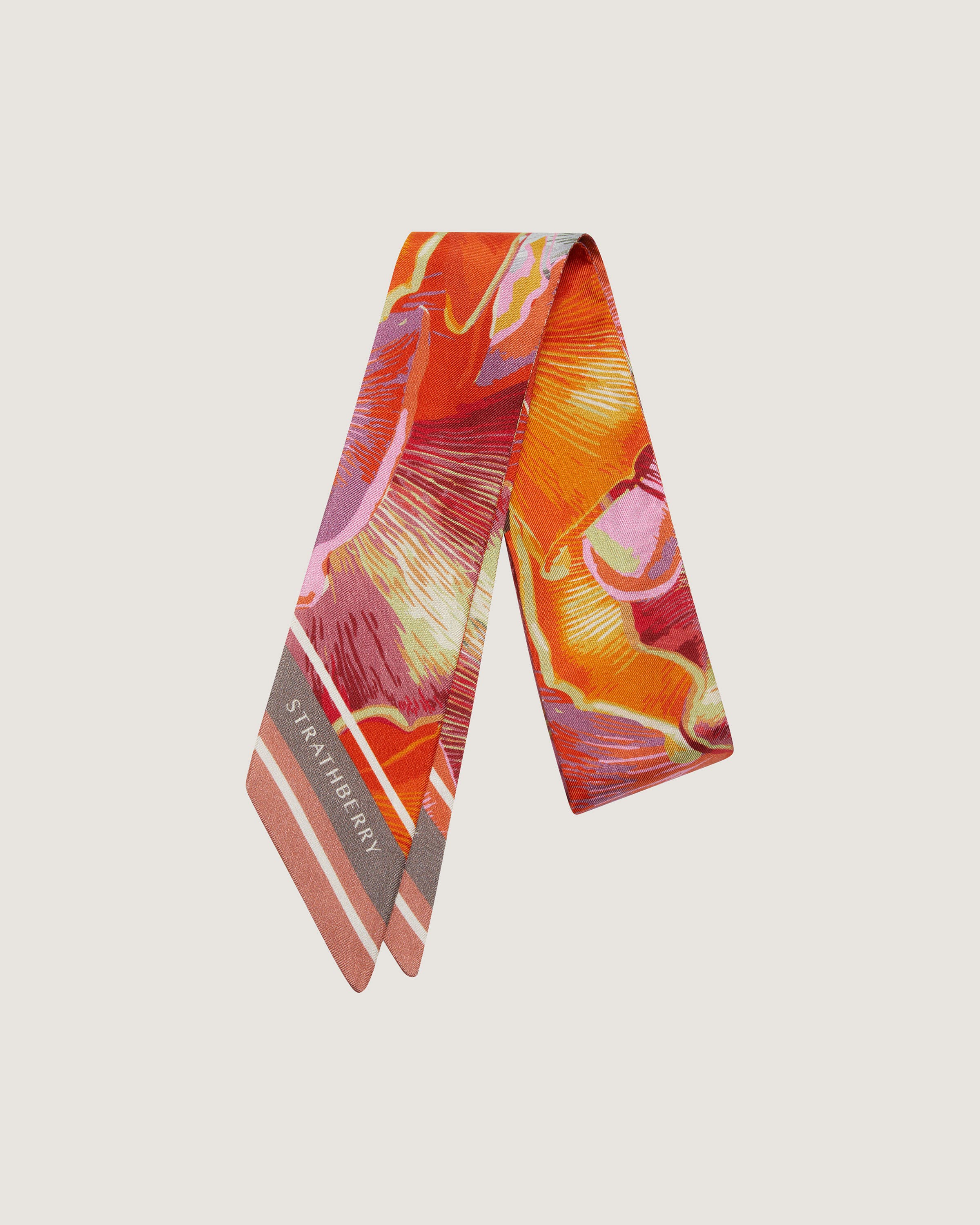 An orange and pink tie on a white background