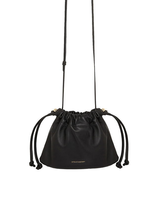 A black leather bag with a drawstring strap