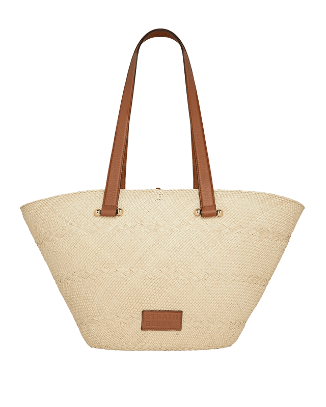 A white and brown bag with brown handles