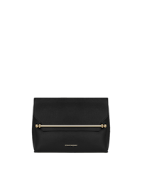 A black clutch bag on a green background