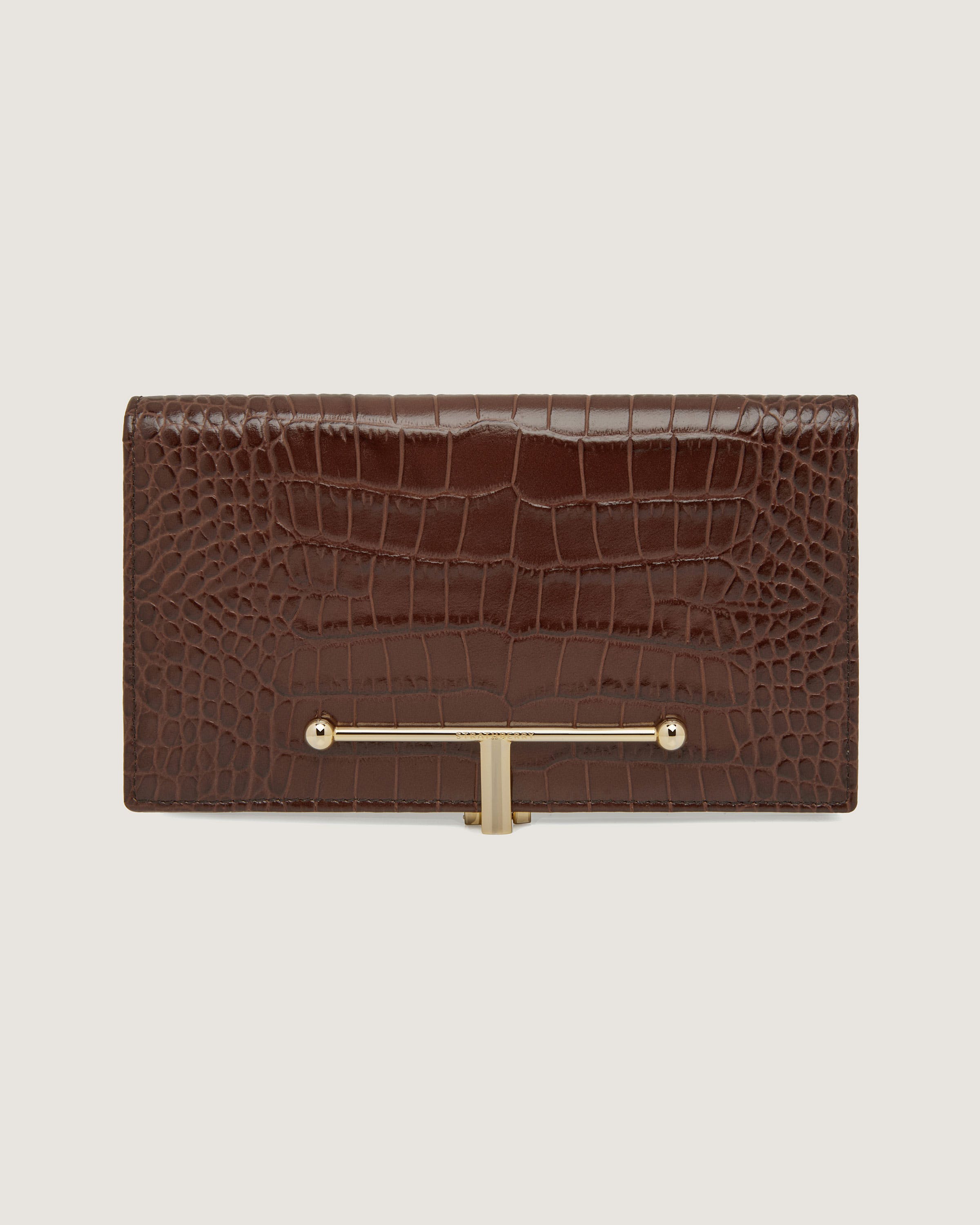 A brown crocodile - embossed leather wallet