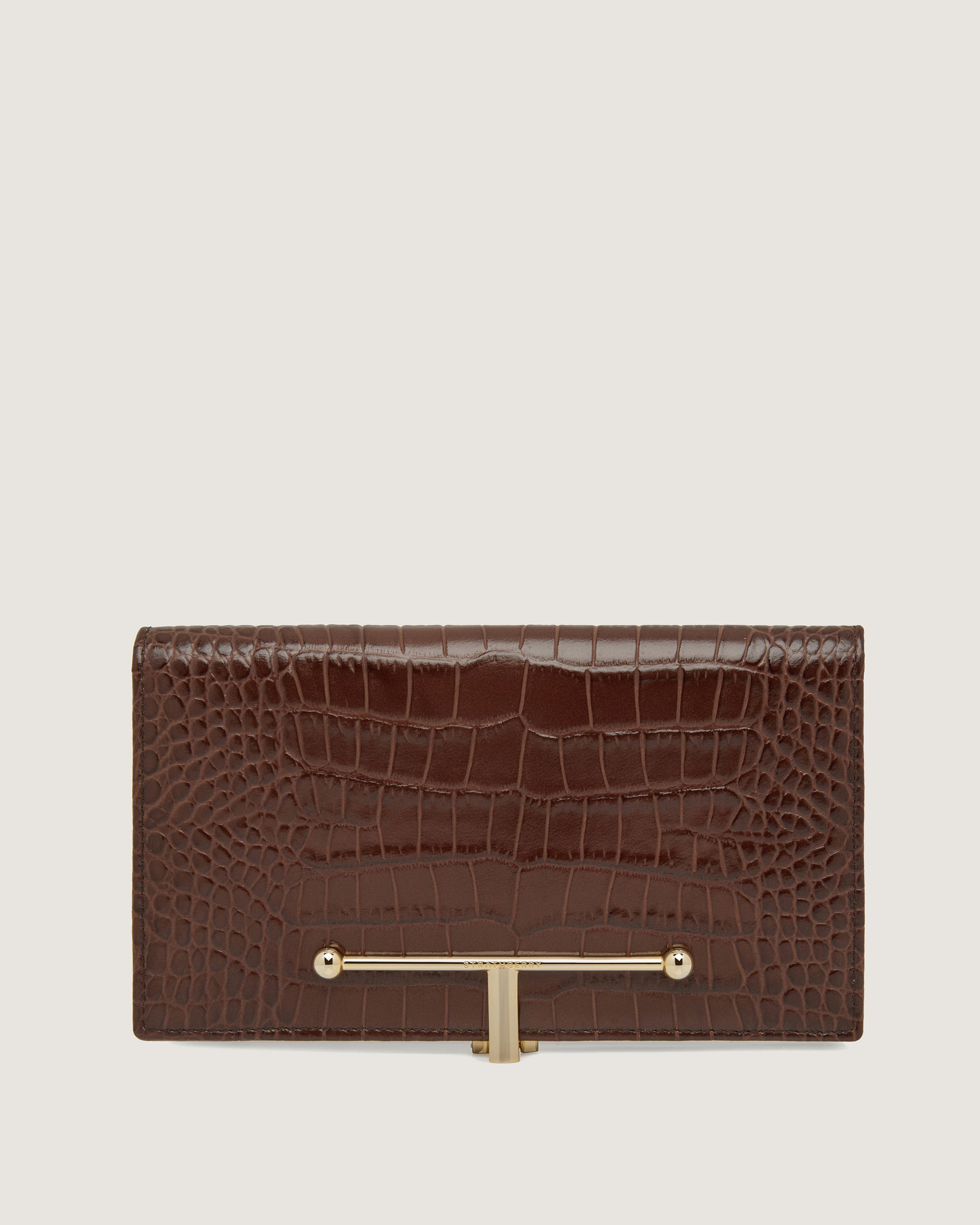 A brown crocodile - embossed leather wallet