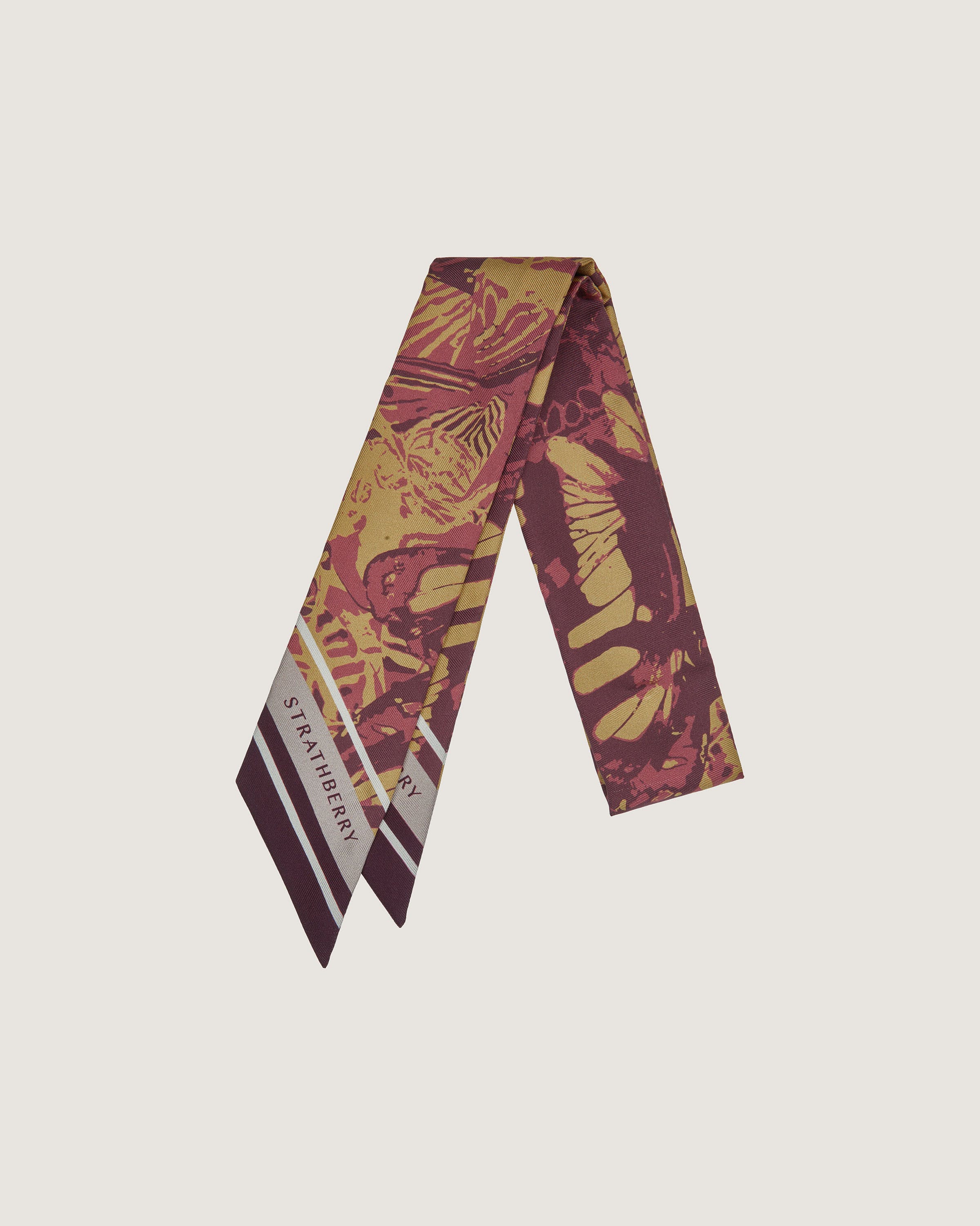 A red and yellow tie with a design on it