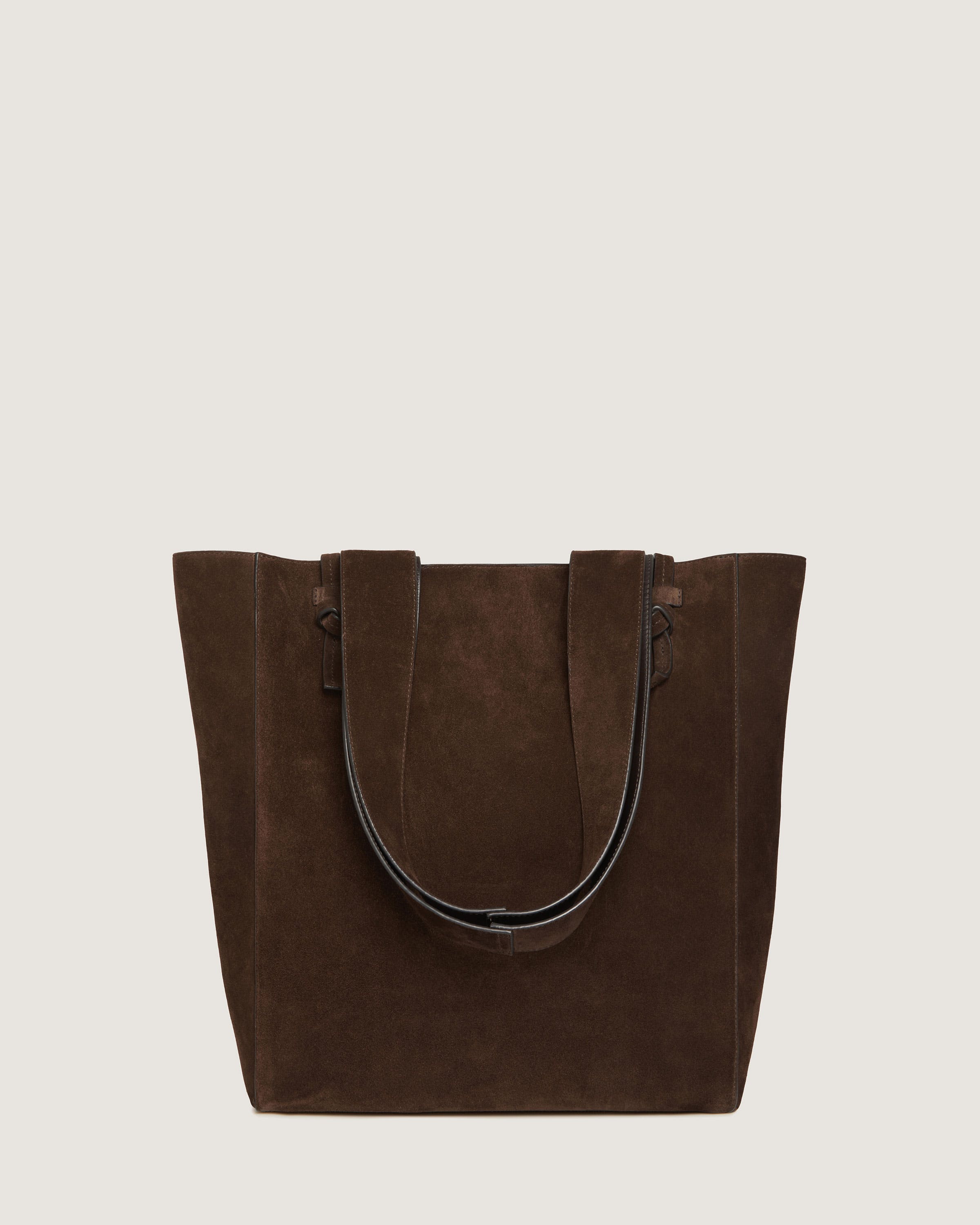 A brown tote bag on a white background