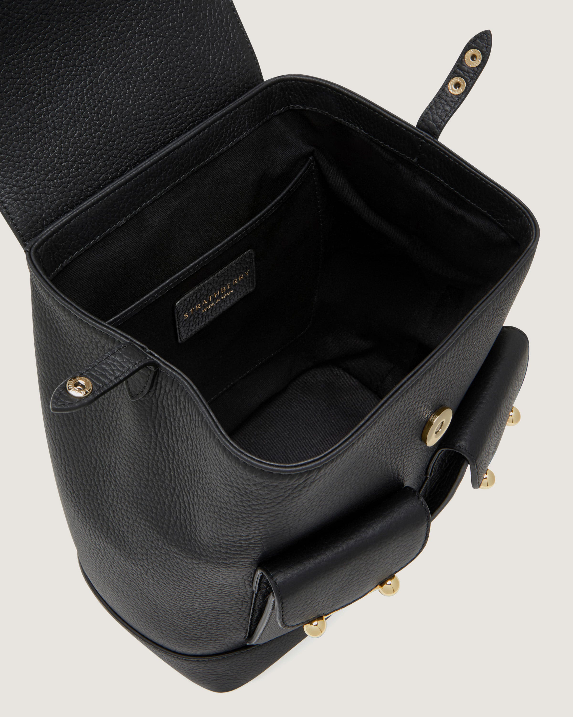 A black leather handbag with a handle