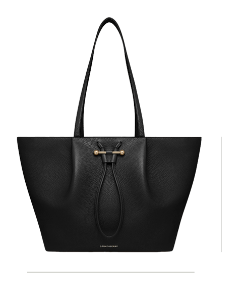 A black tote bag with a gold handle