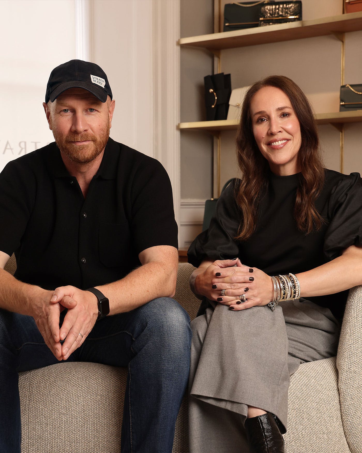 A man and a woman sitting on a couch