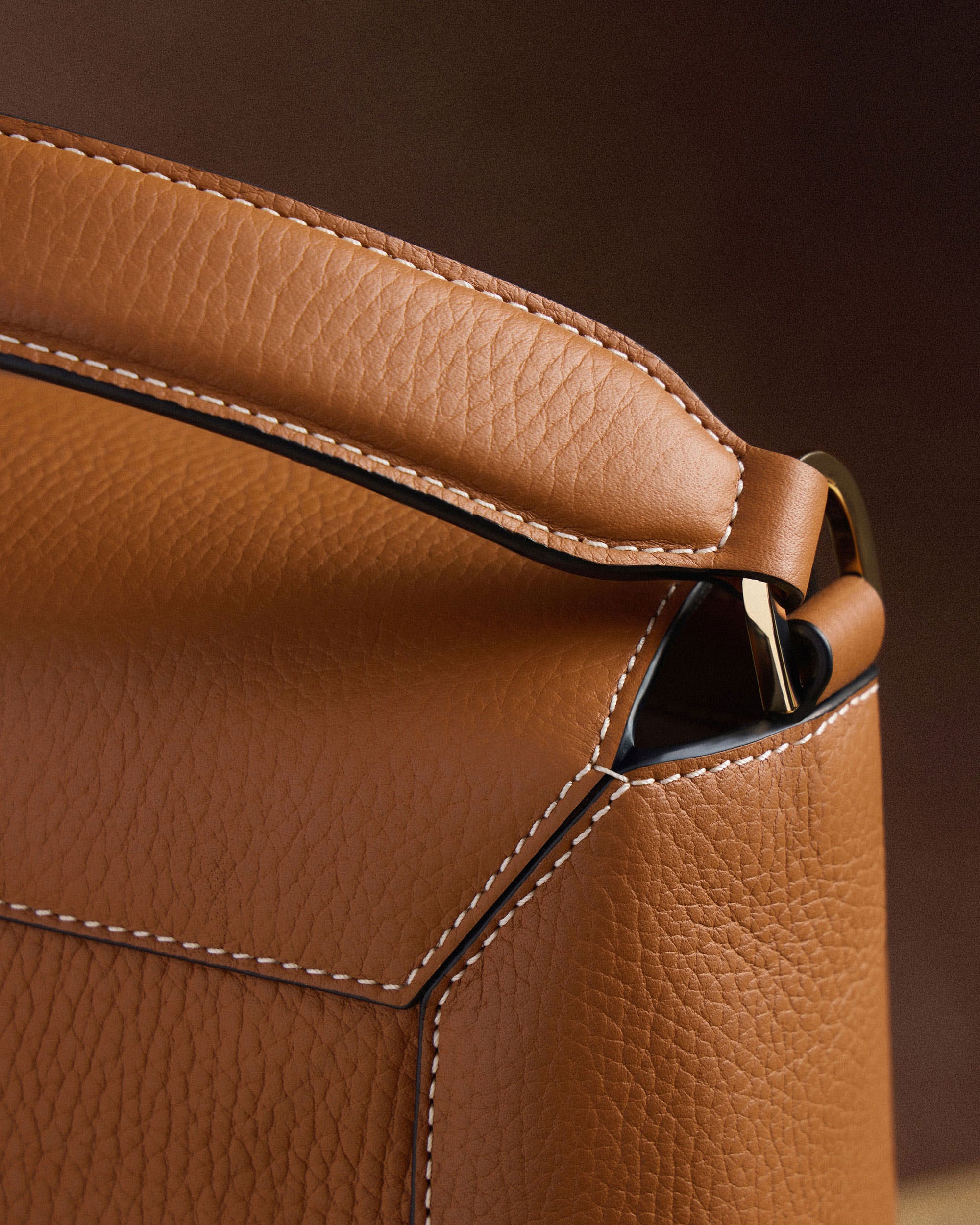 A close up of a brown leather bag