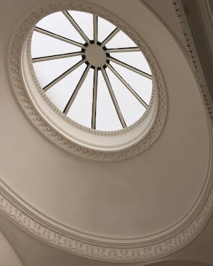 A circular window in the ceiling of a building