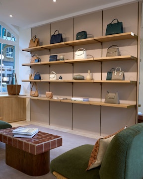 A display of purses and handbags in a store