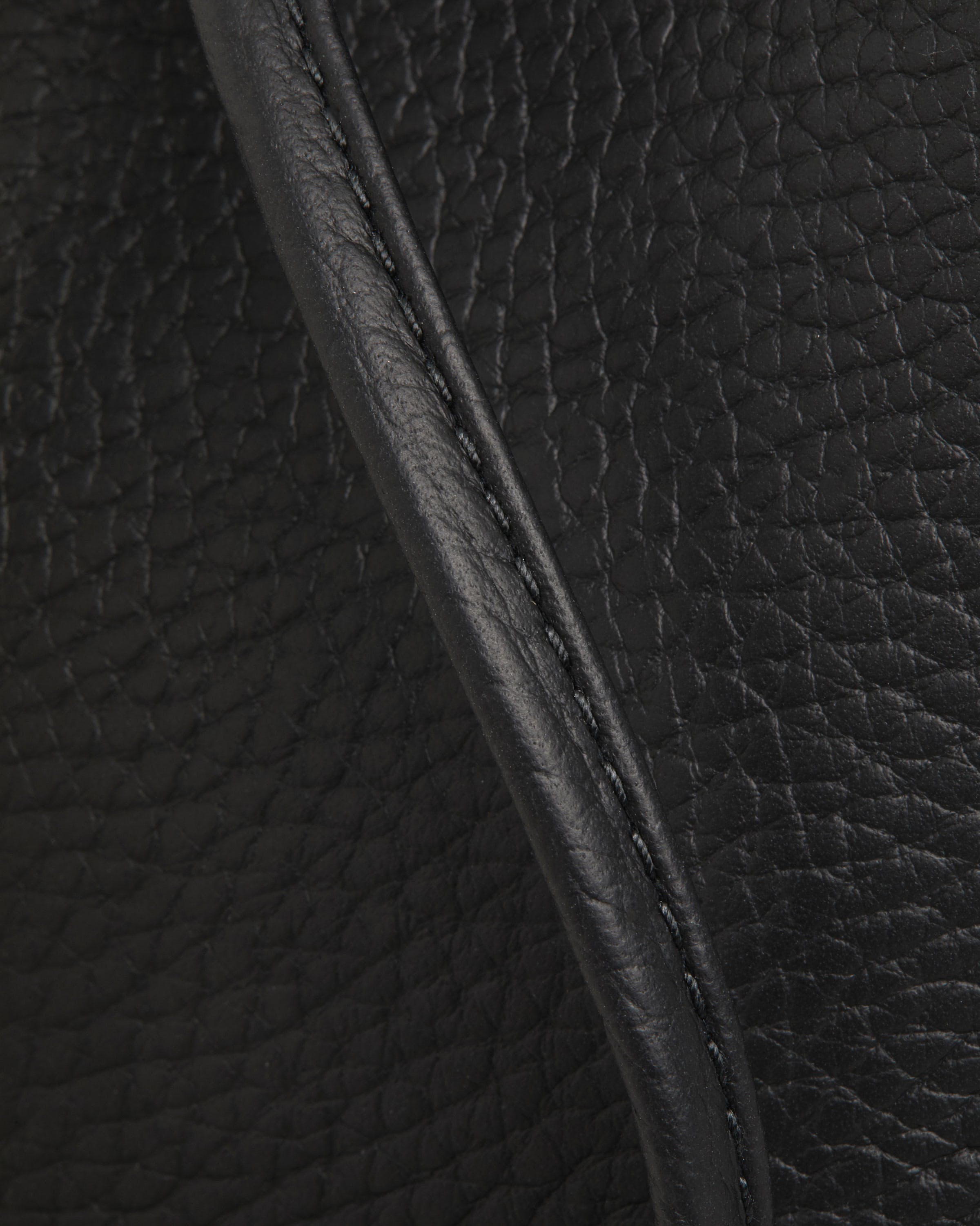 A close up of a black leather texture