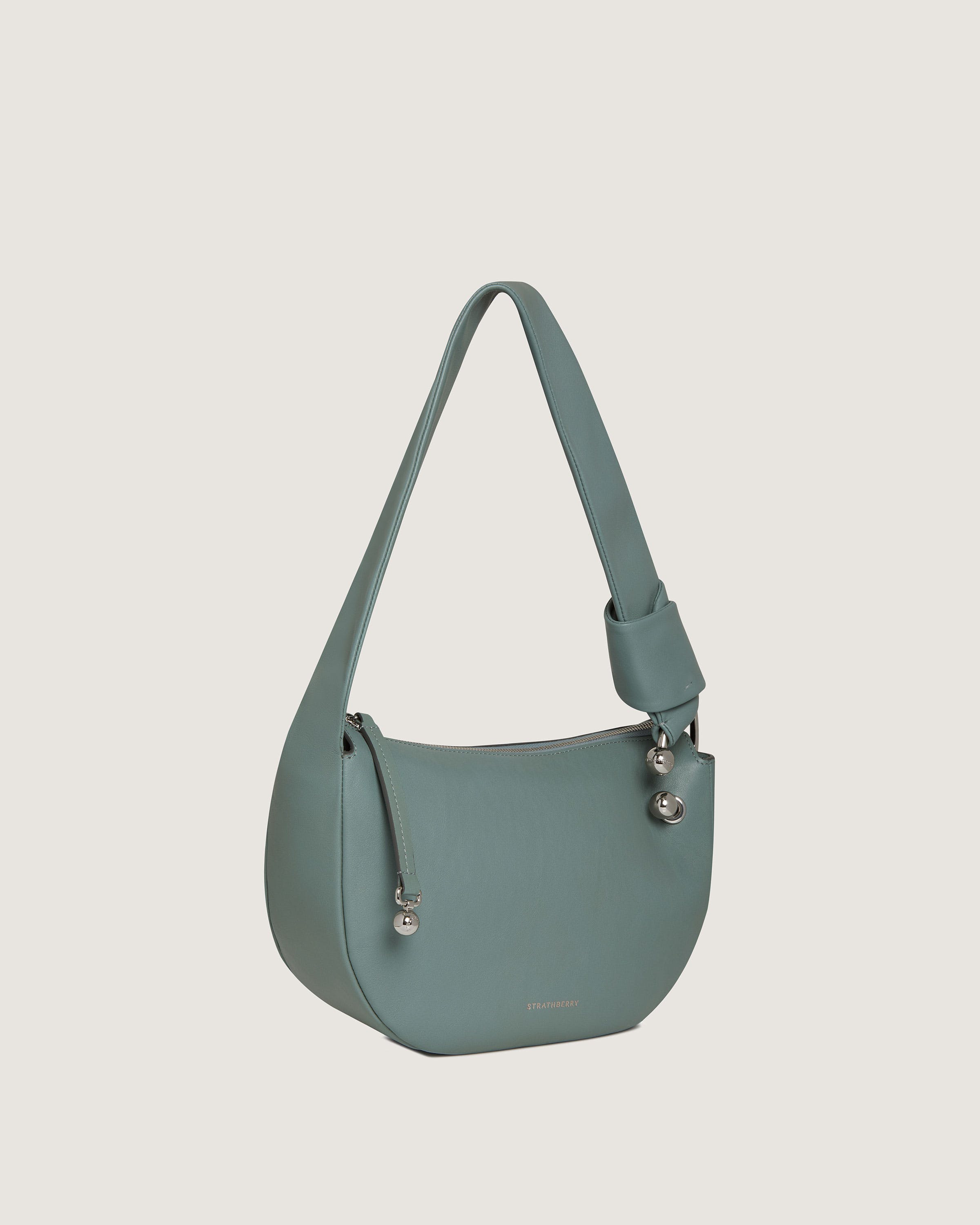 A blue purse with a handle on it