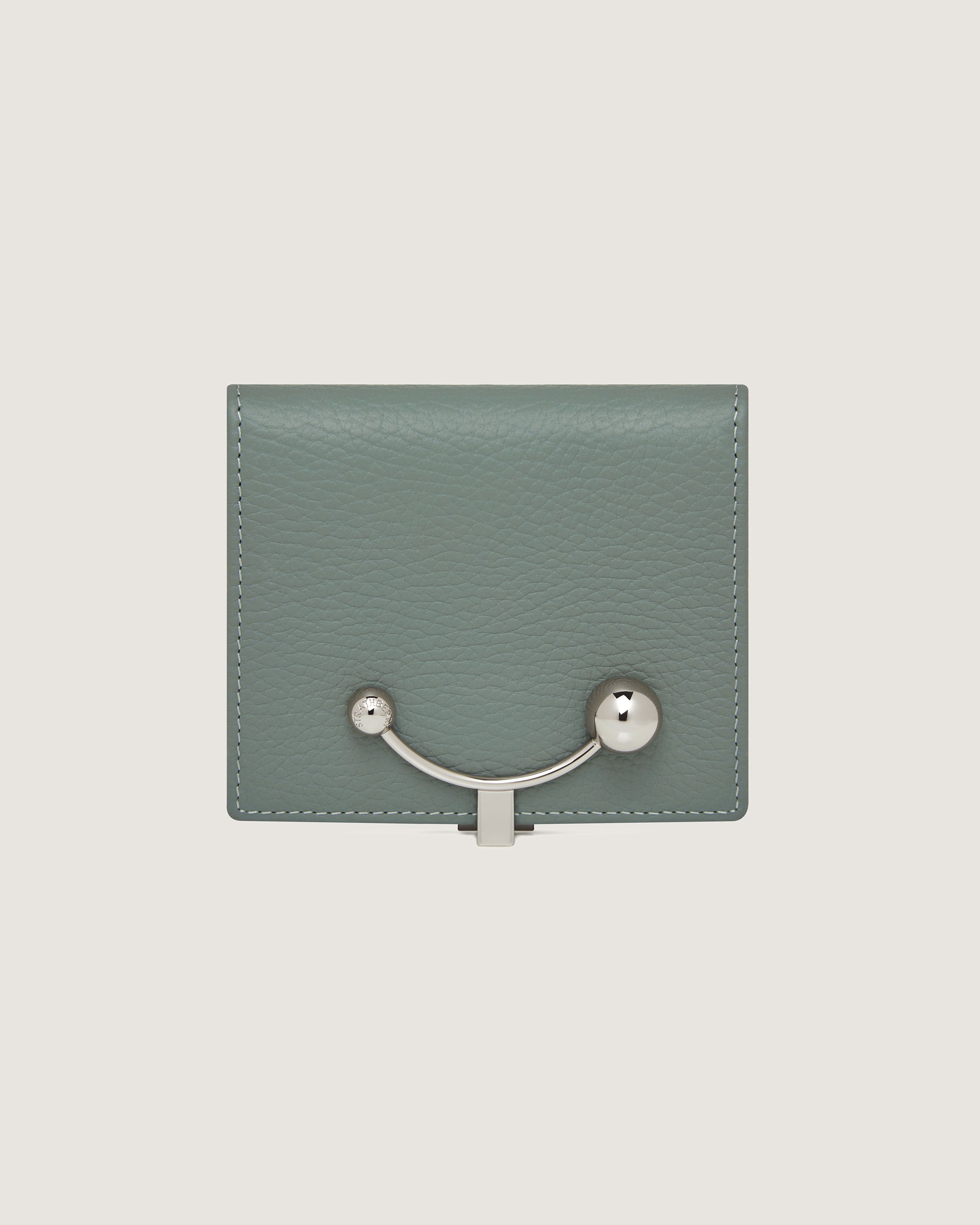 A green leather wallet with a metal handle