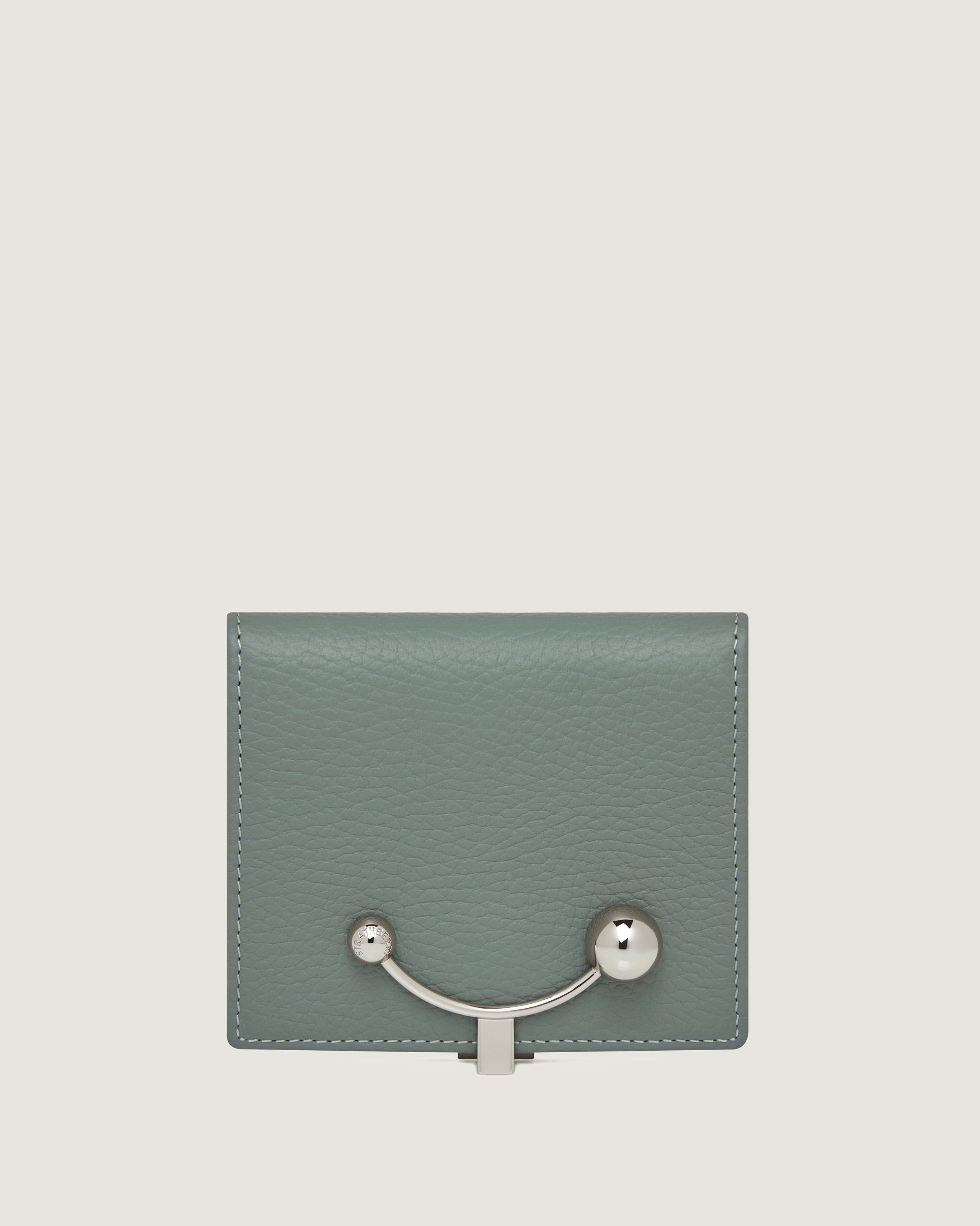 A small green wallet with a metal handle