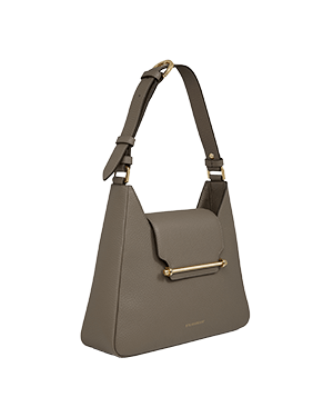 A grey handbag with a gold handle